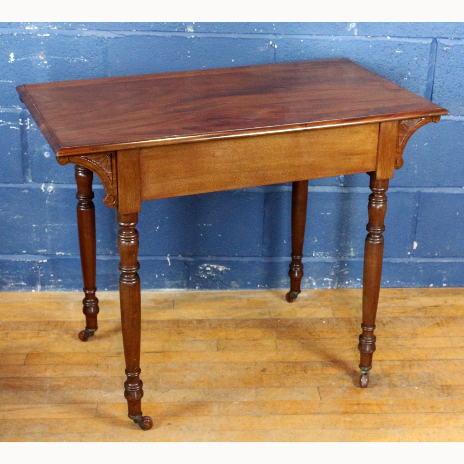 An Art Nouveau Carved Mahogany Side Table, Raised On Turned Supports