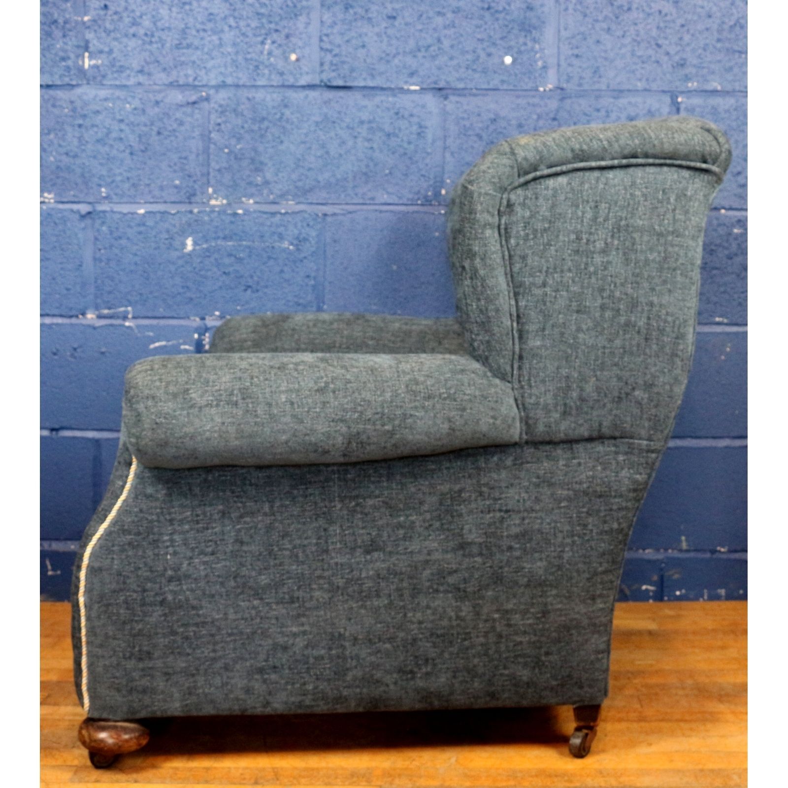 A Large Victorian Freshly Reupholstered Open Wing Arm Chair Raised On Bun Feet photo for sale