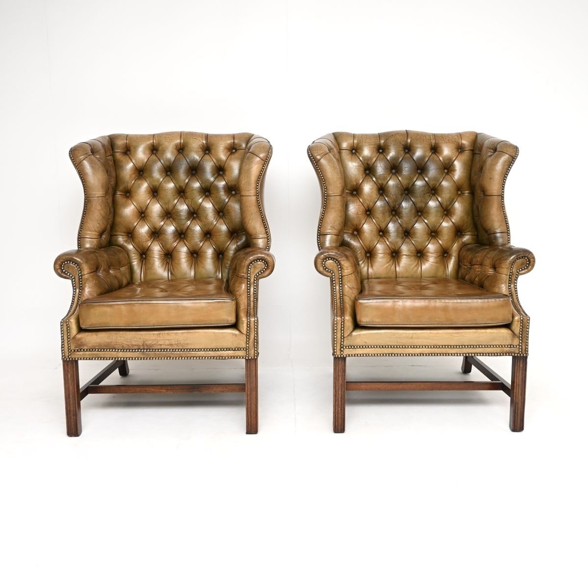 Pair Of Antique Georgian Style Leather Wing Back Armchairs photo for sale