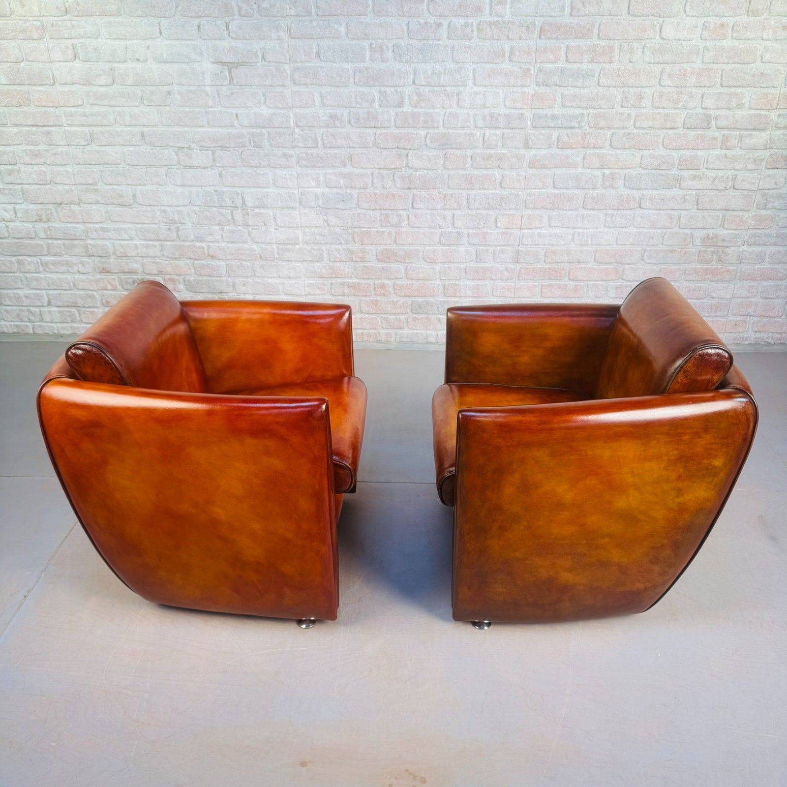 photo furniture Neat Pair Of Contemporary Danish Tan Leather Armchairs – Compact, Comfortable