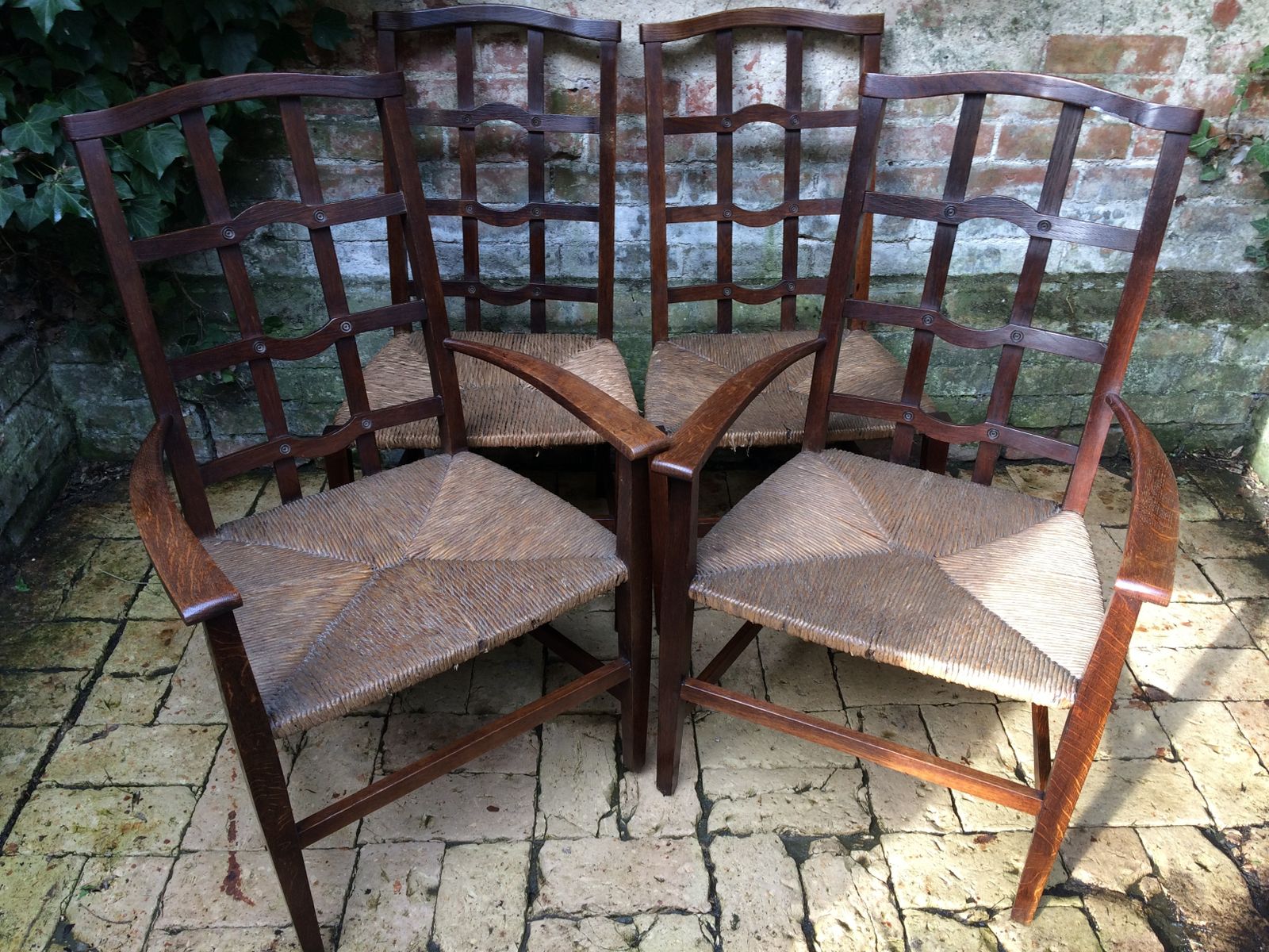 A Set Of Arts And Crafts Oak Cotswold School Chairs