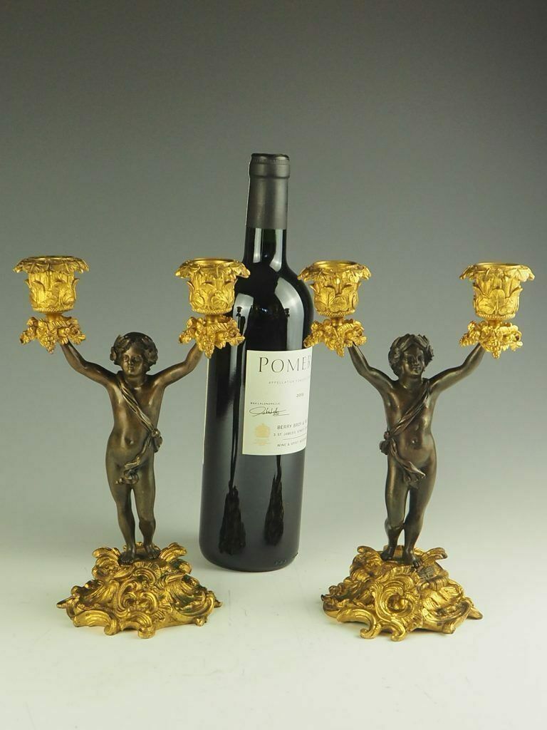 Pair Of 19th Century Bronze And Ormolu Twin Light Cherub Candelabra photo for sale