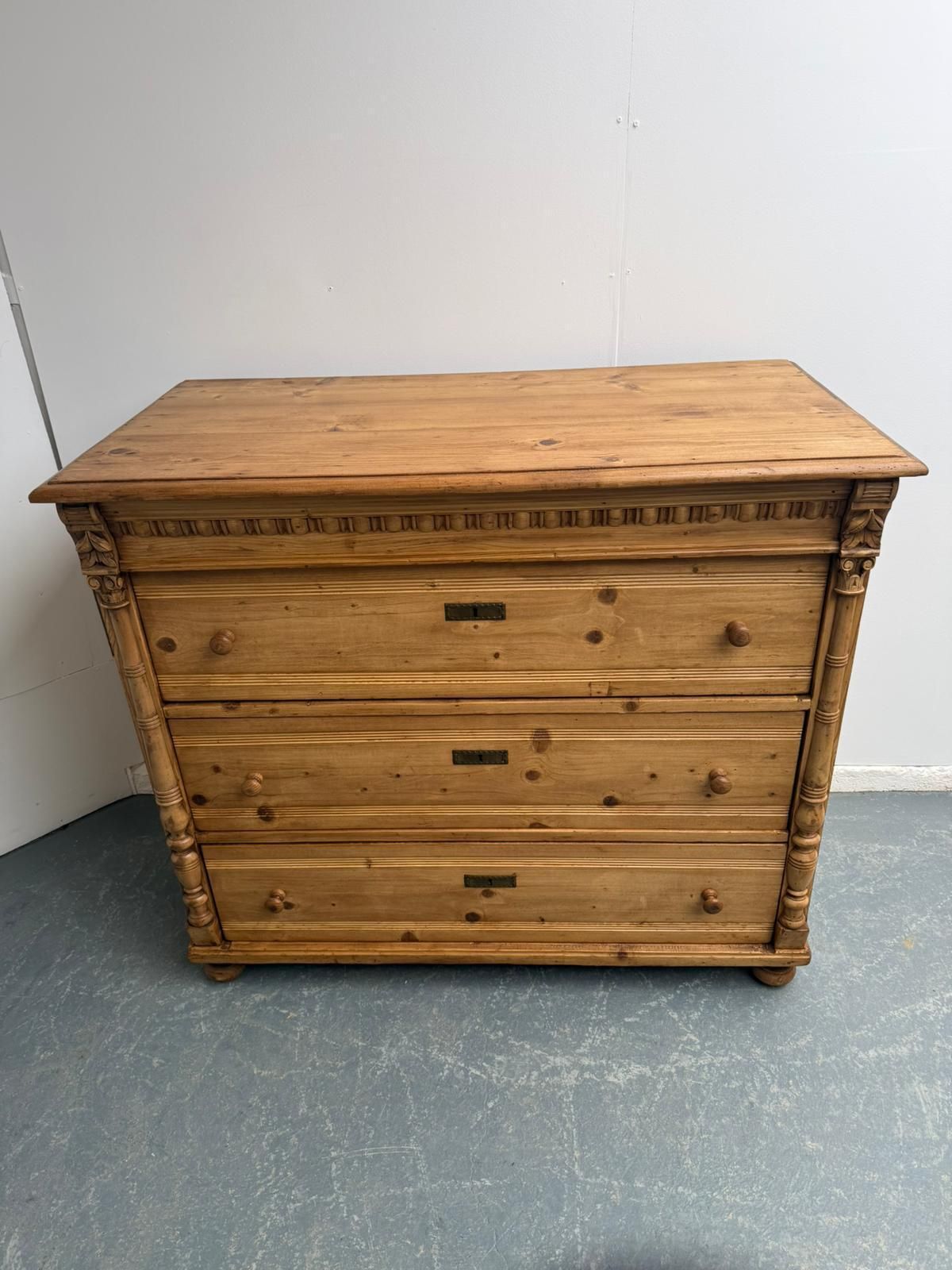 795.0 An Original Antique Pine Columned Hungarian Waxed 3 Drawer Chest Of Drawers photo