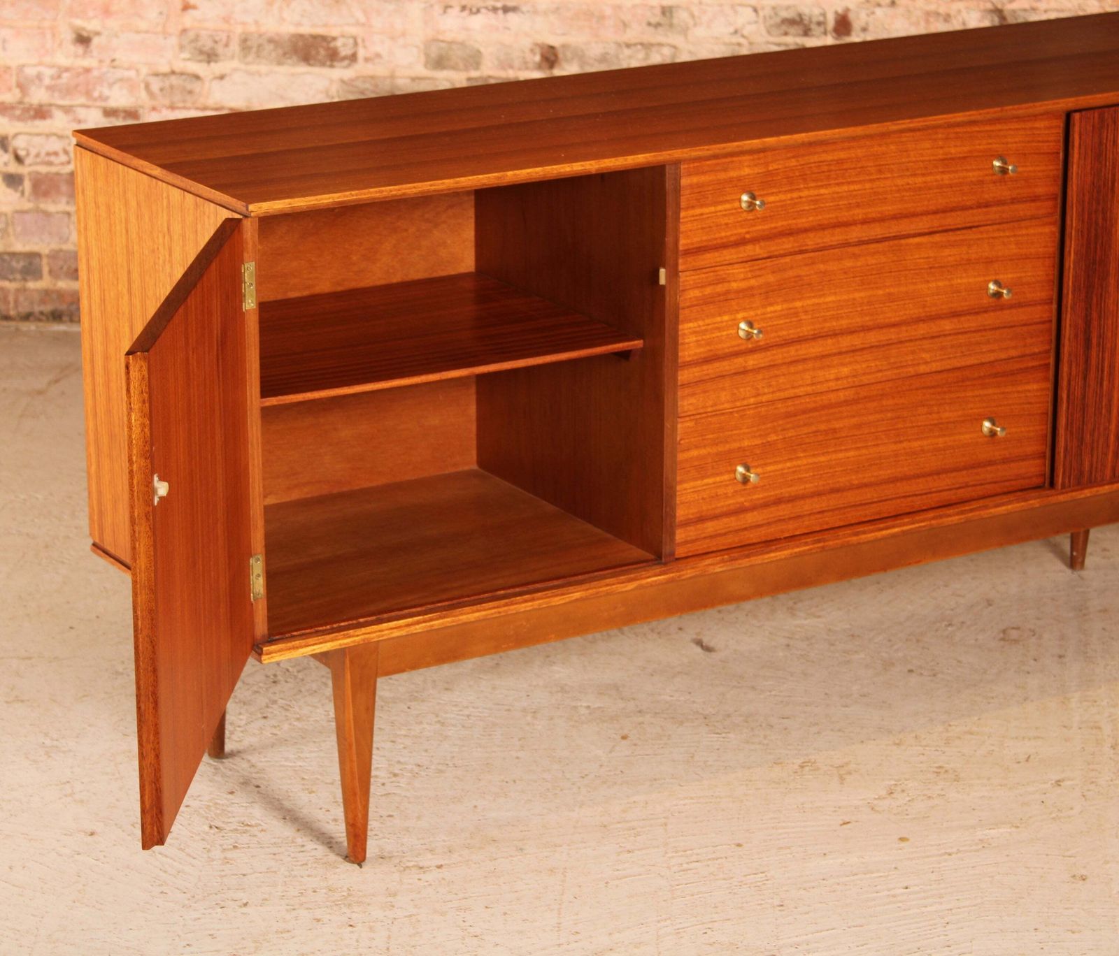 photo for sale Mid Century Teak And Rosewood Sideboard With Brass Handles By Wrighton, Circa 1960s