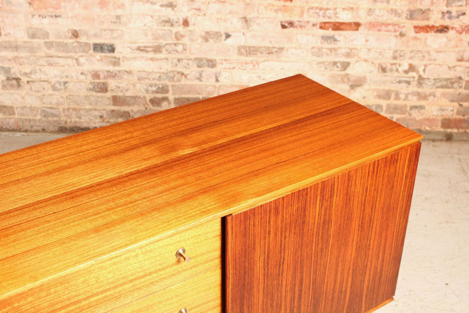 1100.0 Mid Century Teak And Rosewood Sideboard With Brass Handles By Wrighton, Circa 1960s photo