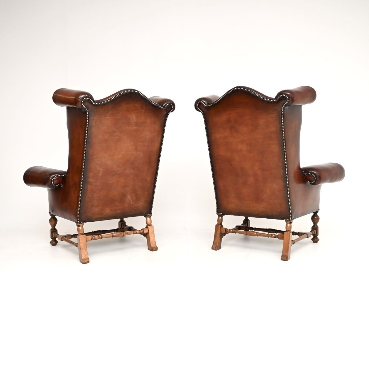 photo furniture Pair Of Antique Leather Wing Back Armchairs