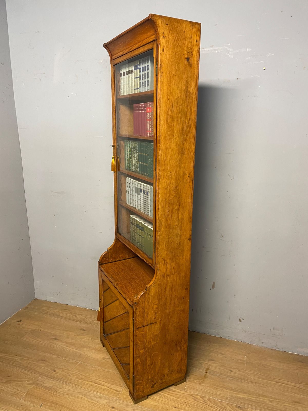 Arts And Crafts Golden Oak Slim Bookcase Over Cupboard photo vintage