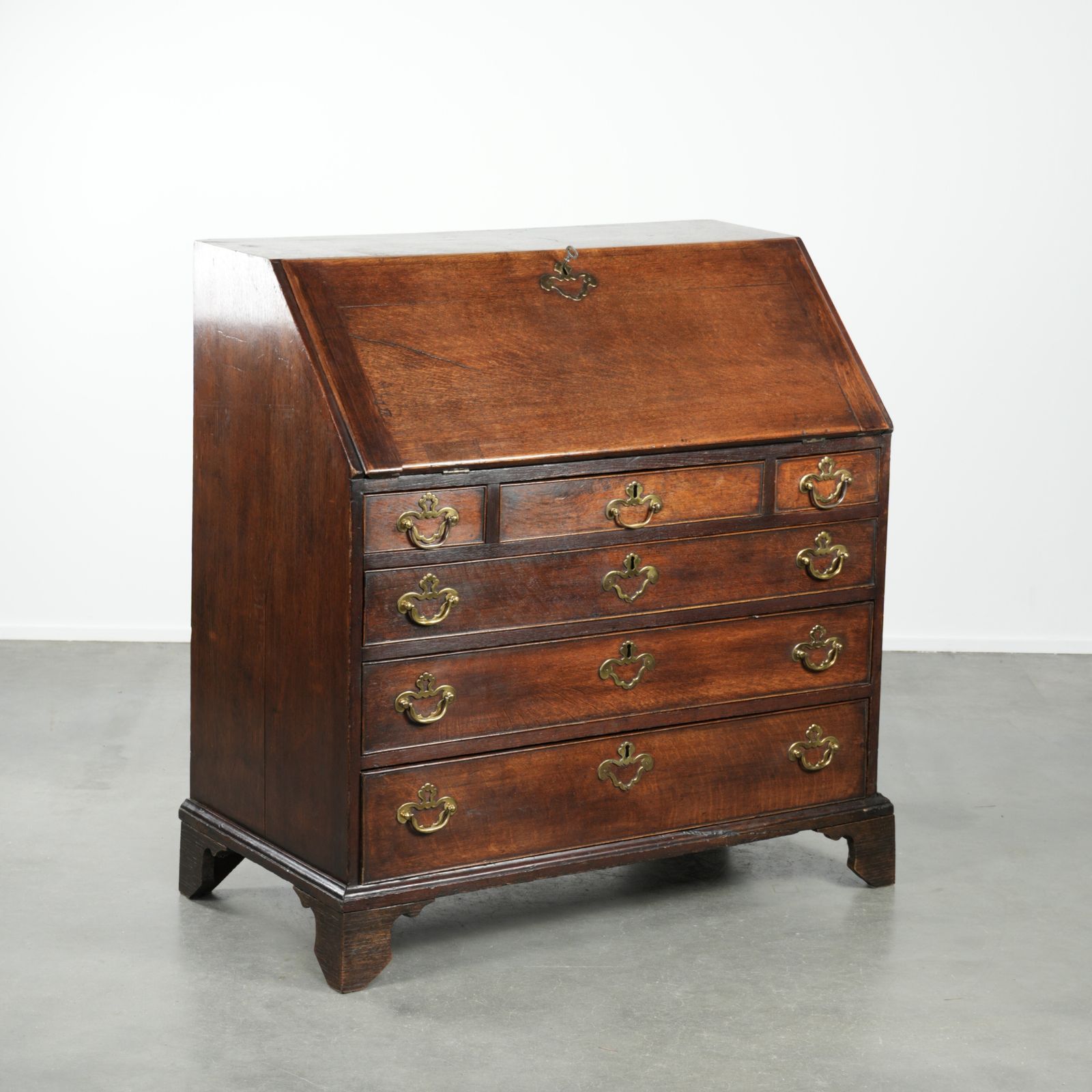 Beautiful Antique English Secretary Desk From The 18th Century Made Of Oak With Original Fittings And 6 Drawers.