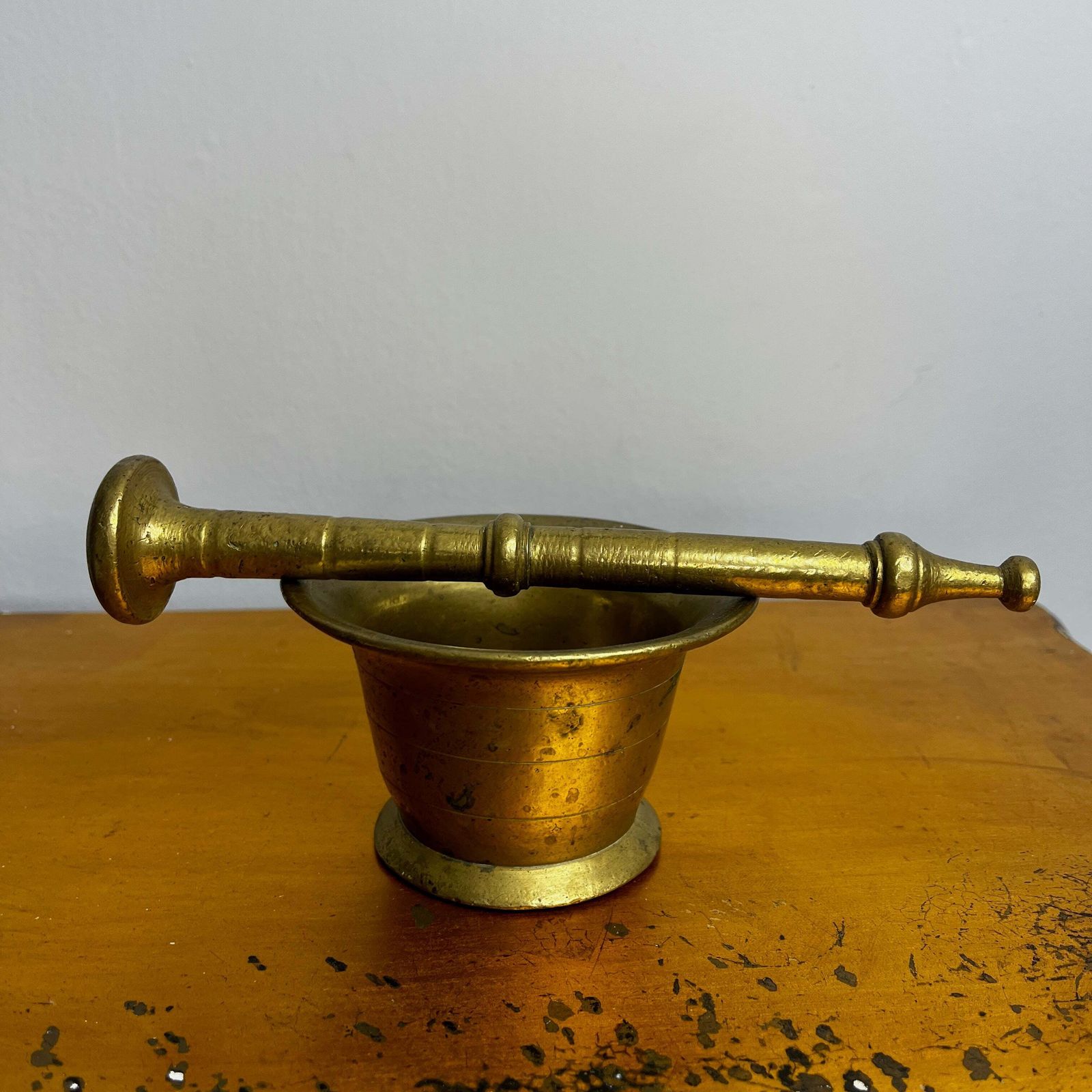 Antique Brass Mortar And Pestle On A Carved Wooden Wall Bracket photo for sale