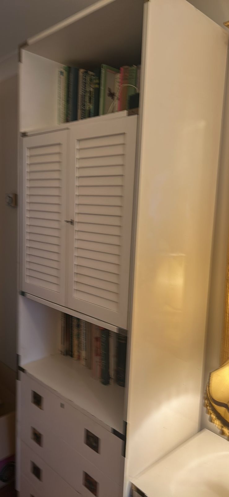 A Mid Century Modular White Shelving Unit In A Campaign Style With Solid Brass Features photo vintage
