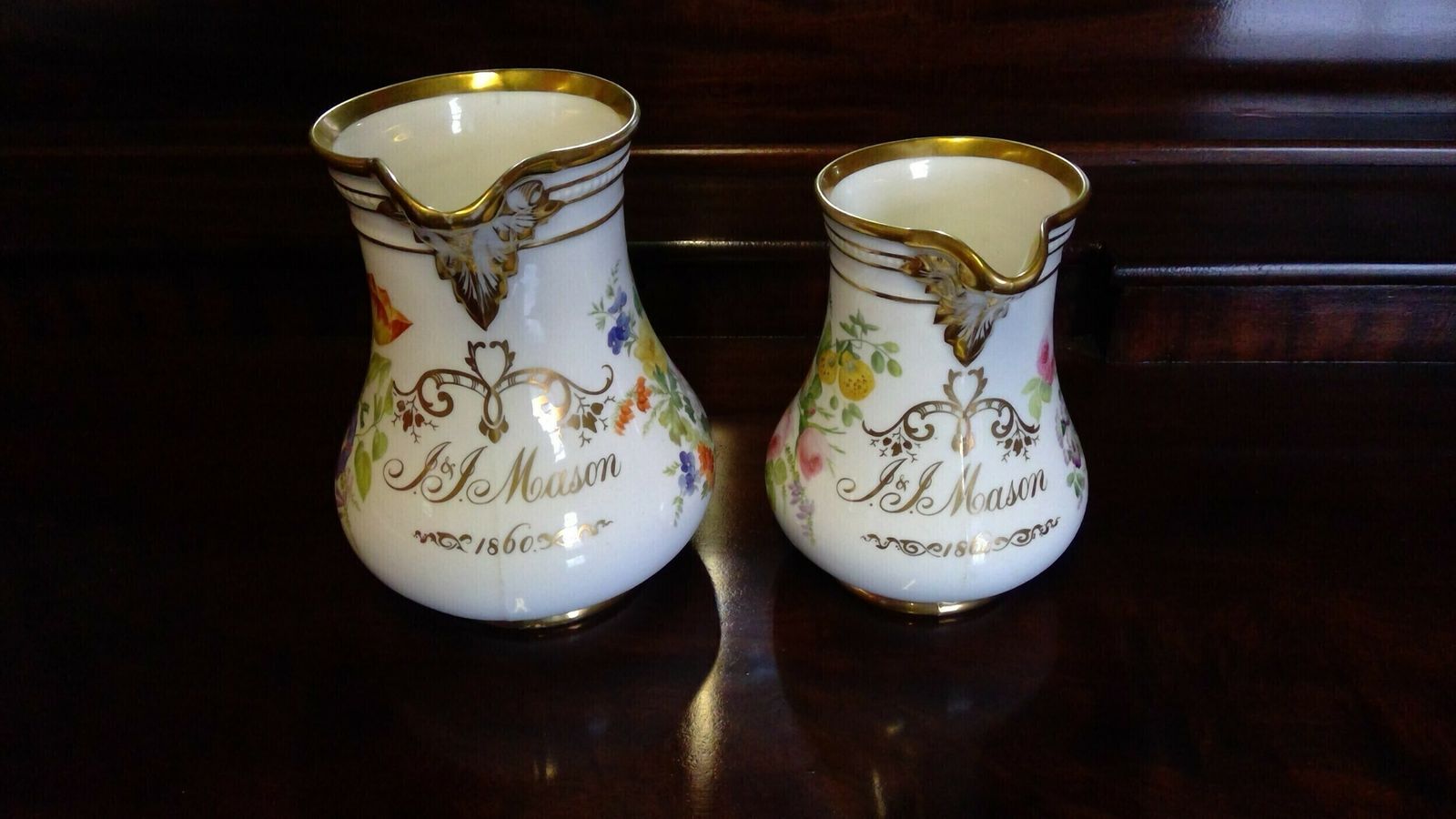 A Fine Quality Pair Of Rockingham Coalport Porcelain Botanical Floral Decorated Marriage Jugs Highlighted In Giltwork Dated 1860 photo Home Decor