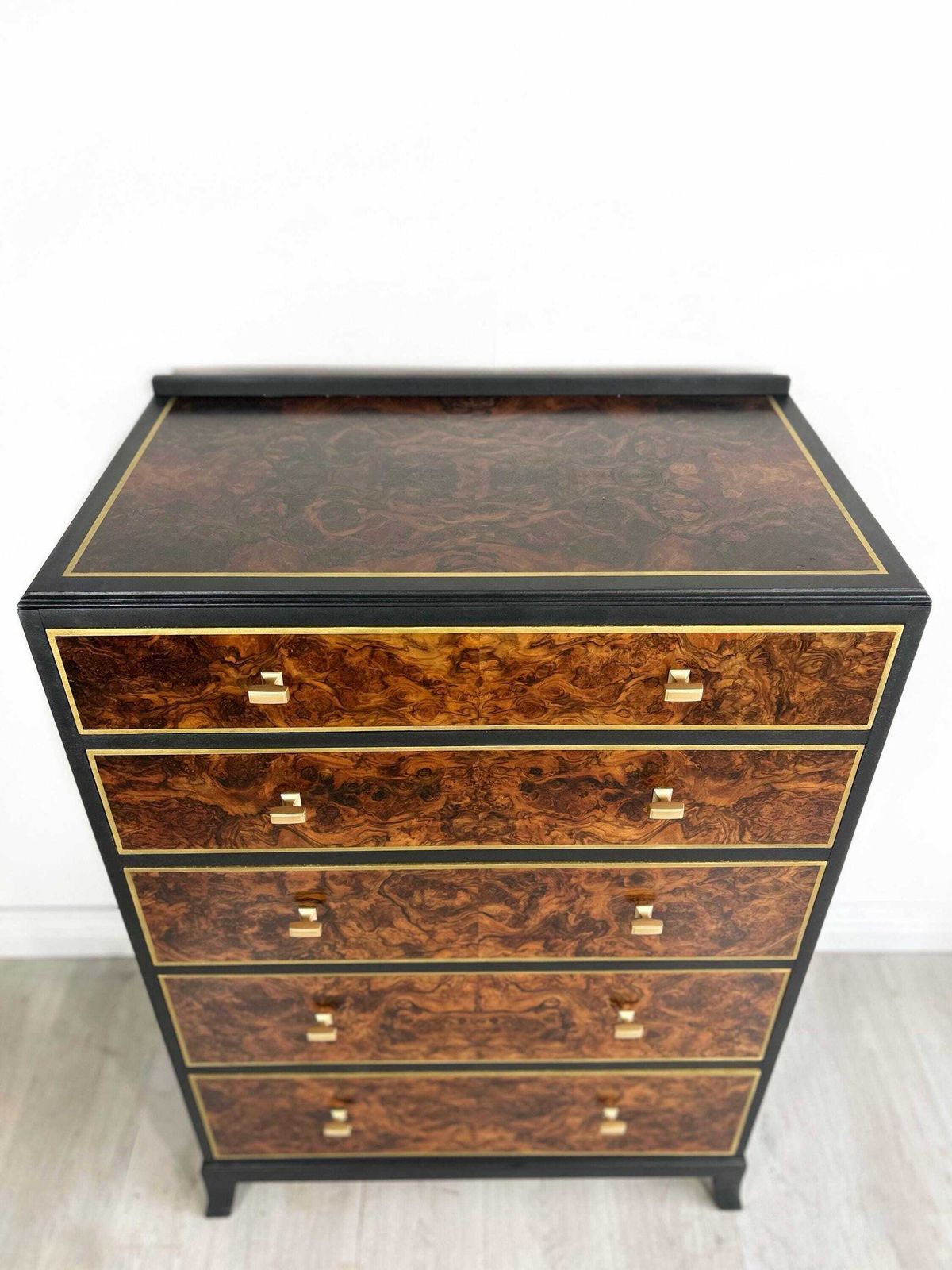 photo furniture Chest Of 5 Drawers Painted In Black And Gold
