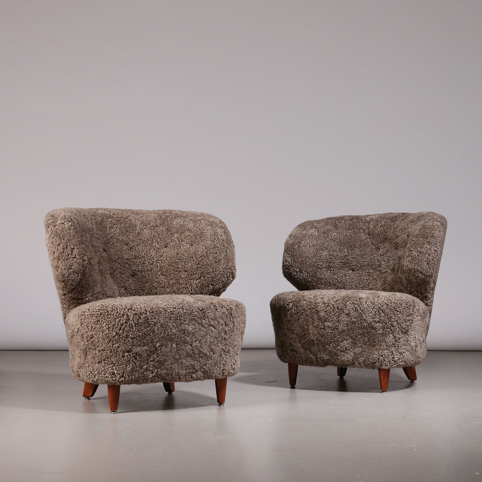 Carl Johan Boman Pair Of Finnish Curved Easy Chairs In Sahara Sheepskin, 1940s