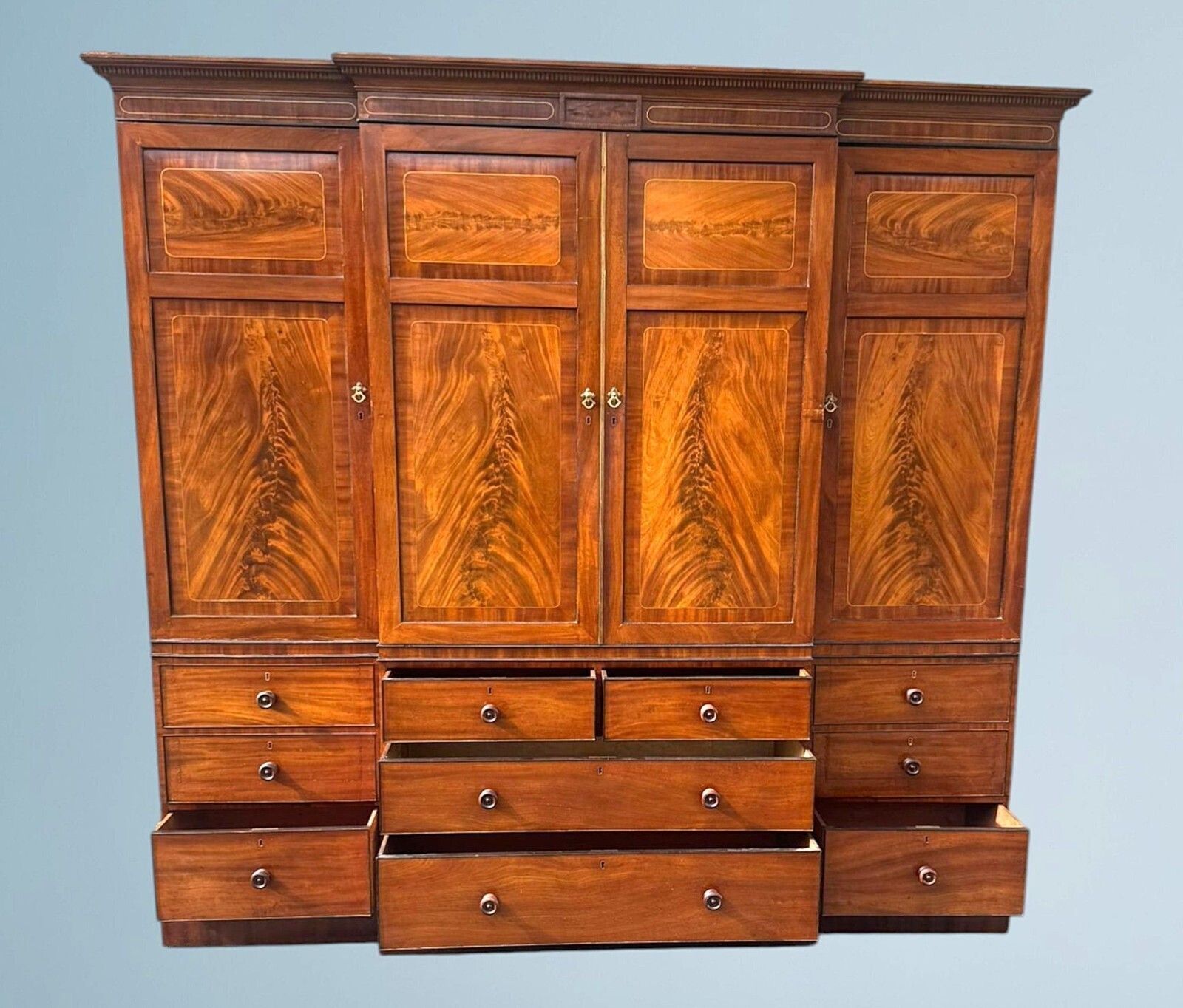 Furniture A Large Regency Figured Mahogany Breakfront Wardrobe With Brass Inlaid Decoratio photo