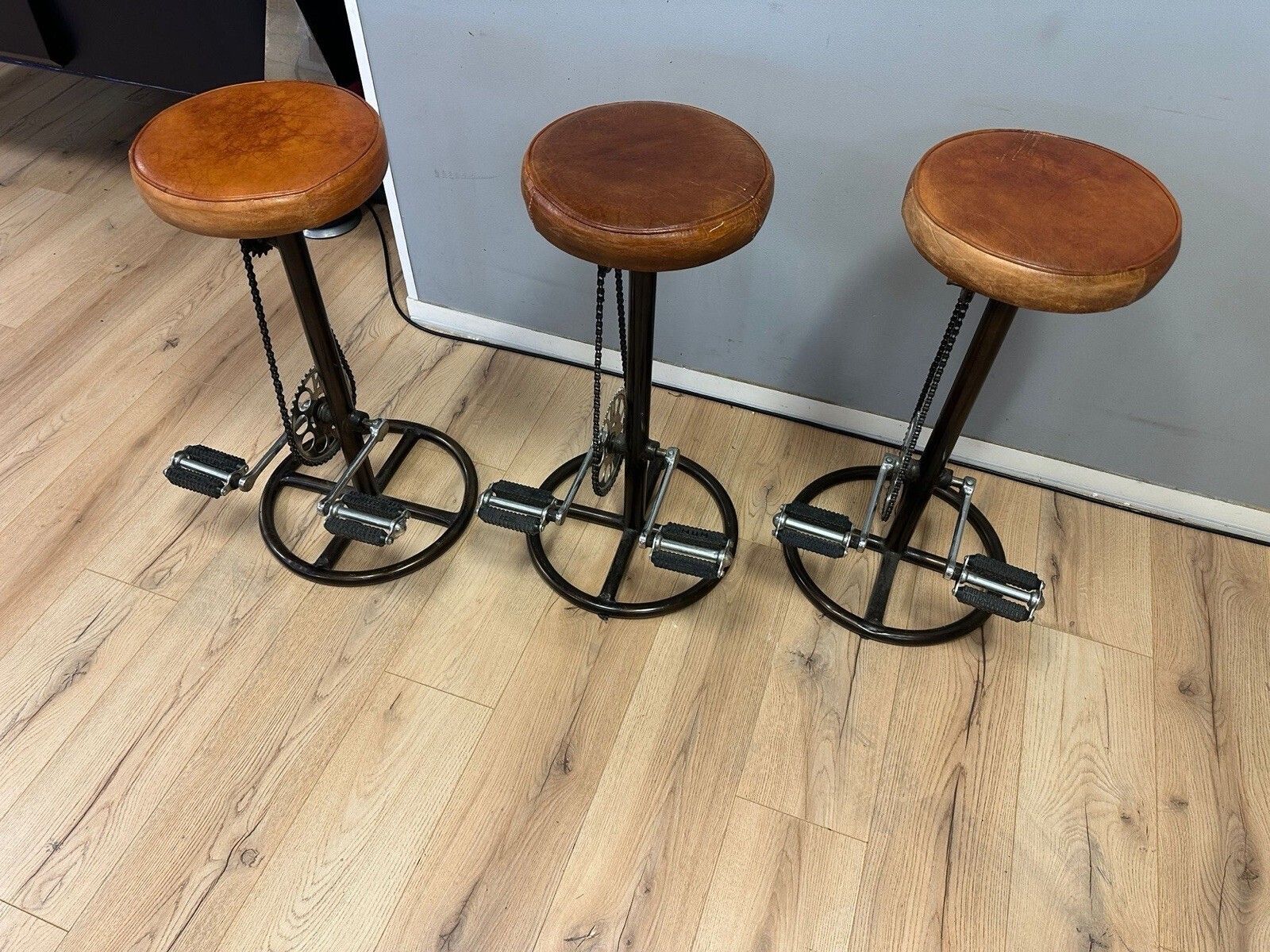 Industrial Distressed Tan Leather Bicycle Bar Stool Set Of 3 Pedal Style Vintage photo for sale