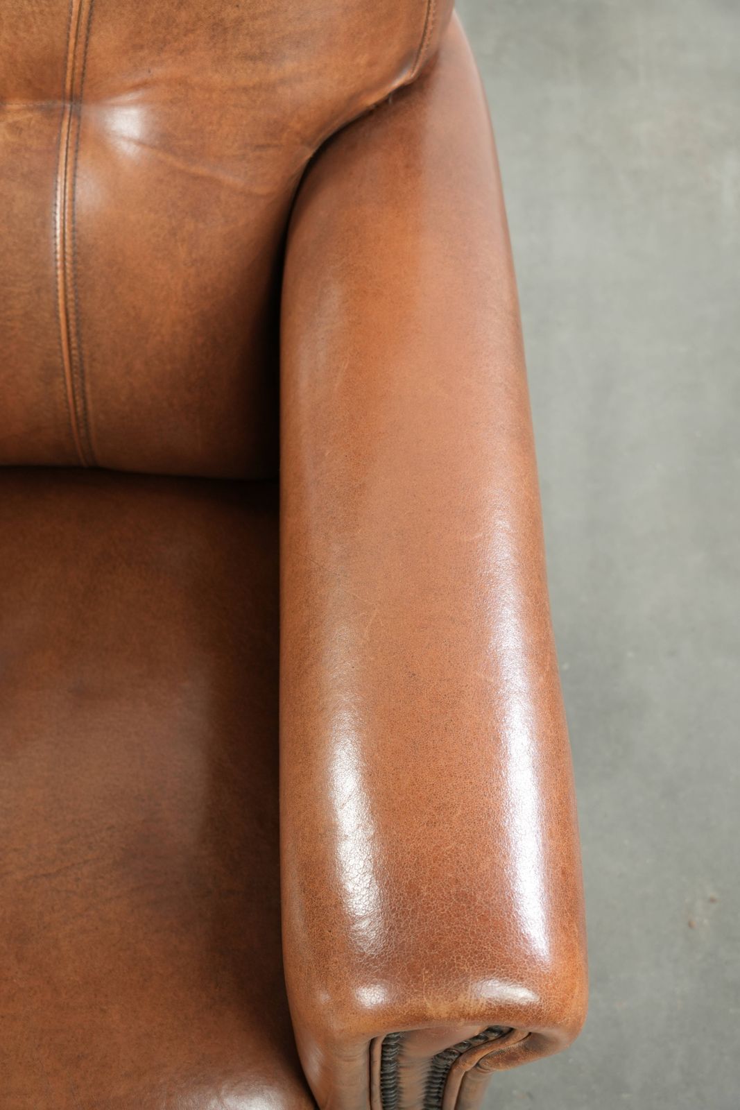 Beautiful, Stately Armchair In Good Condition, Made Of Sheepskin With A Refined Finish Featuring Decorative Nails. photo vintage