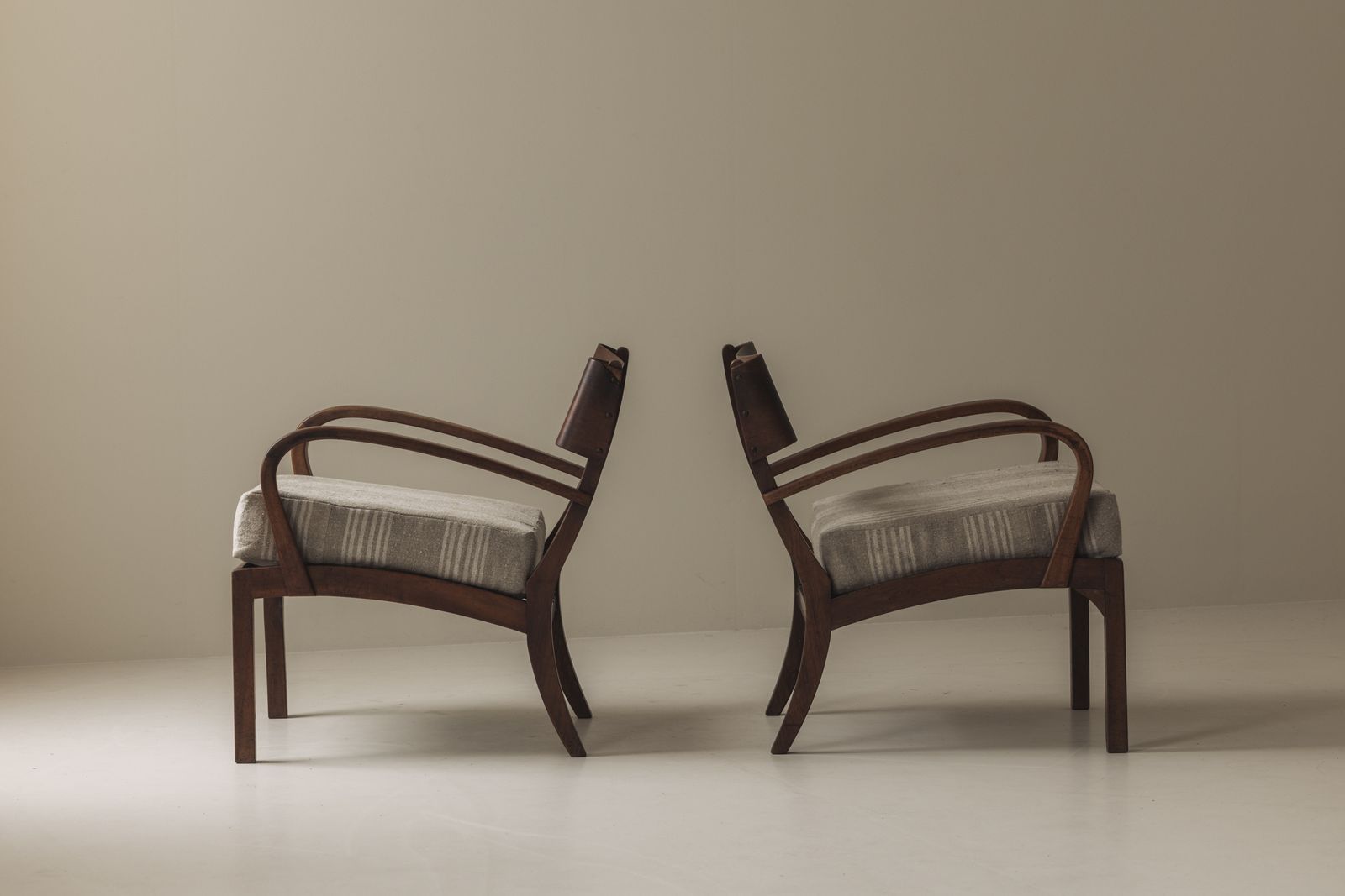 photo furniture Sculptural Pair Of Italian Easy Chairs In Walnut From The 1950s.