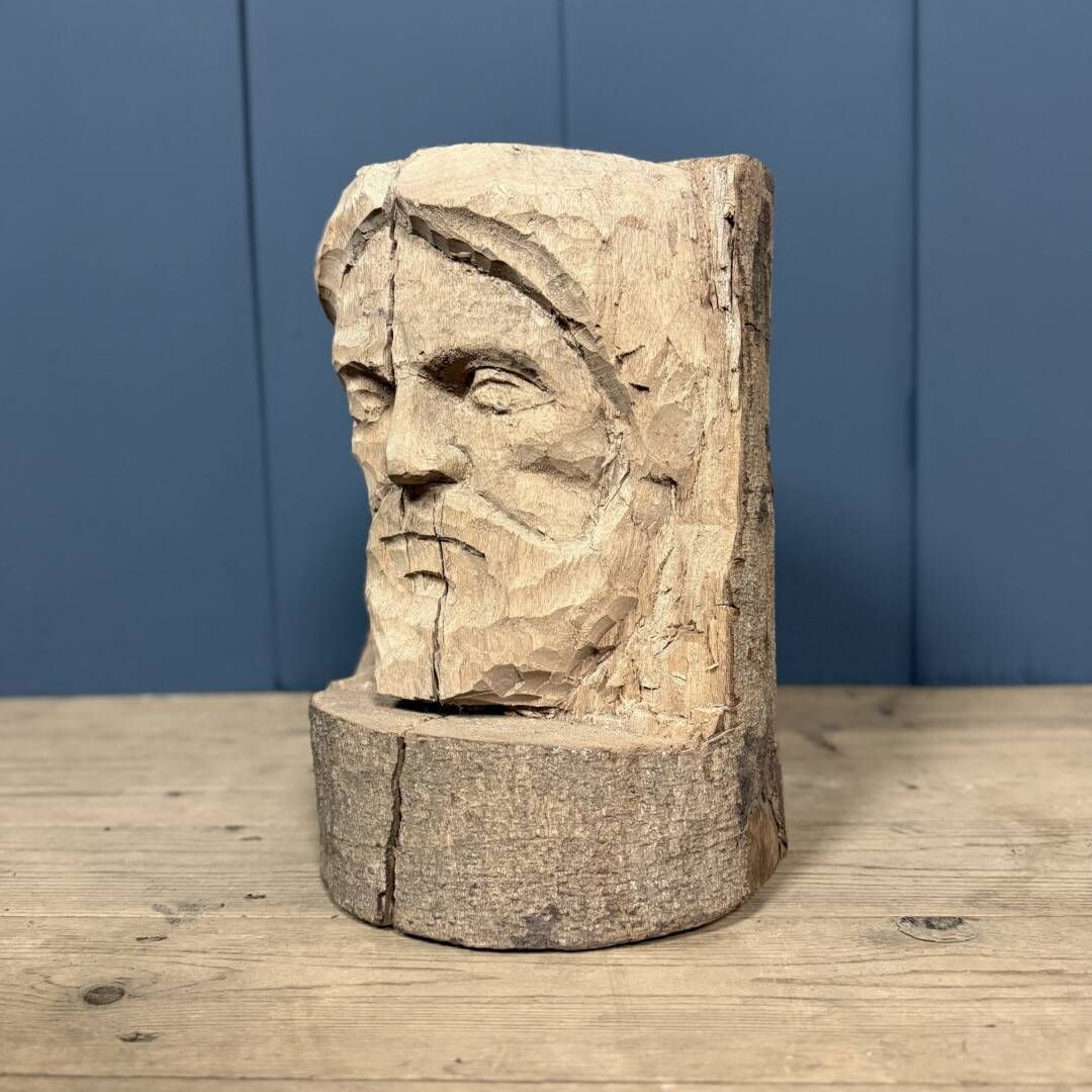 Head Of A Bearded Man Carved From A Wooden Trunk photo Furniture