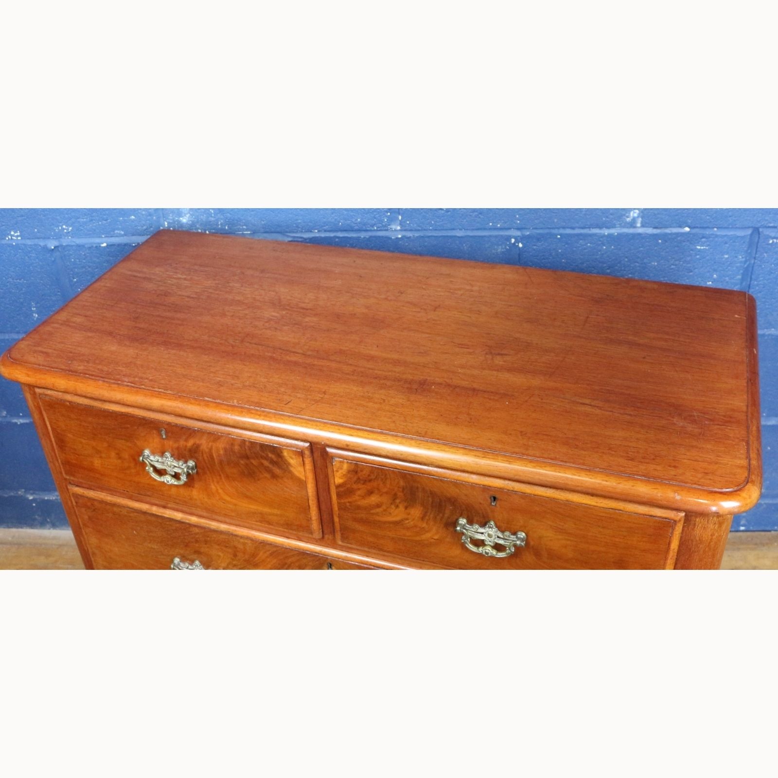 A Victorian Mahogany Two Over Two Chest Of Drawers Raised On Bun Feet photo for sale