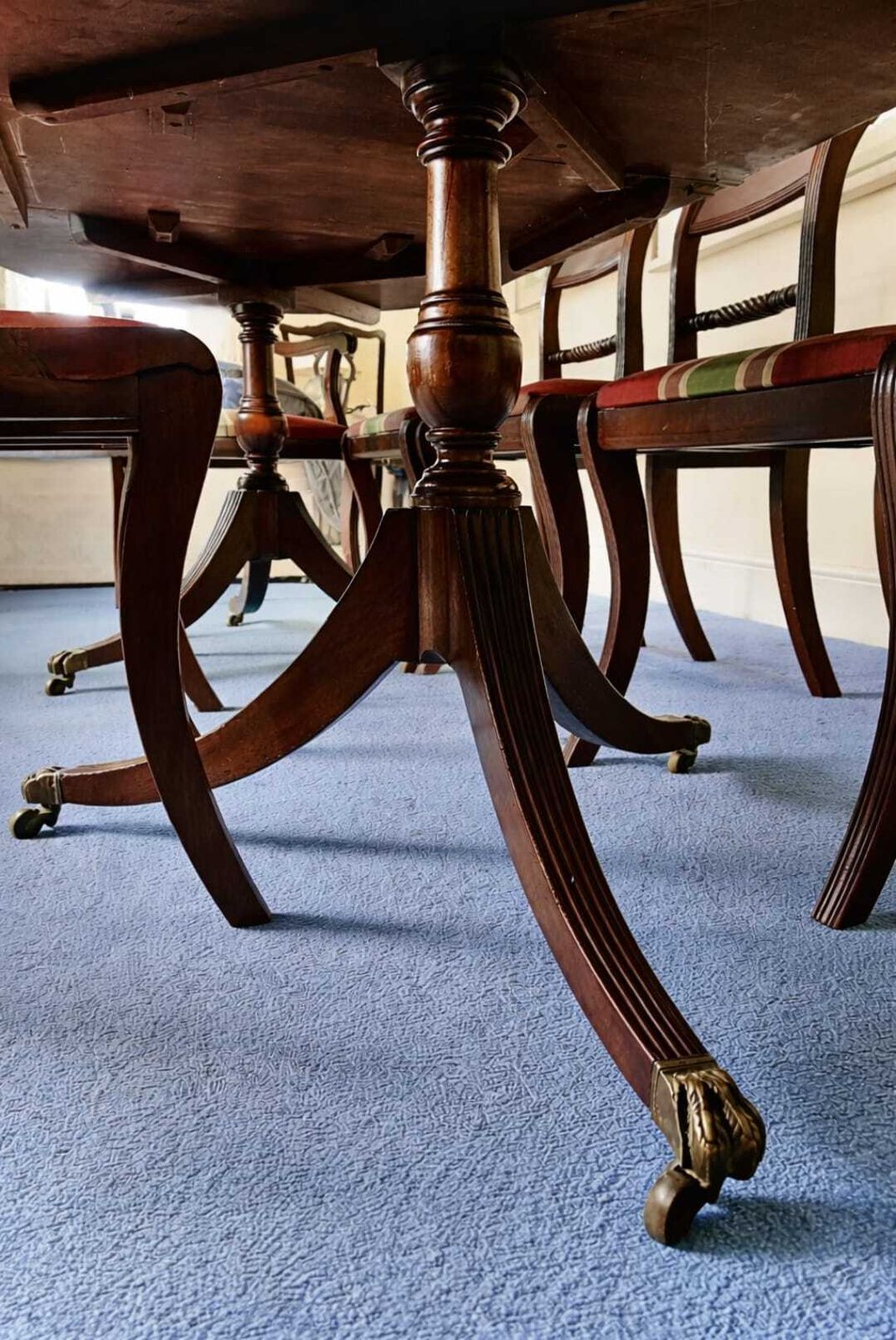 Regency Style Twin Pillar Dining Table With Removable Central Leaf.  Features Splayed Legs With Brass Castors Designed To Sit Up To 8 People.  Comes With 5 Chairs And 2 Carvers. photo Furniture