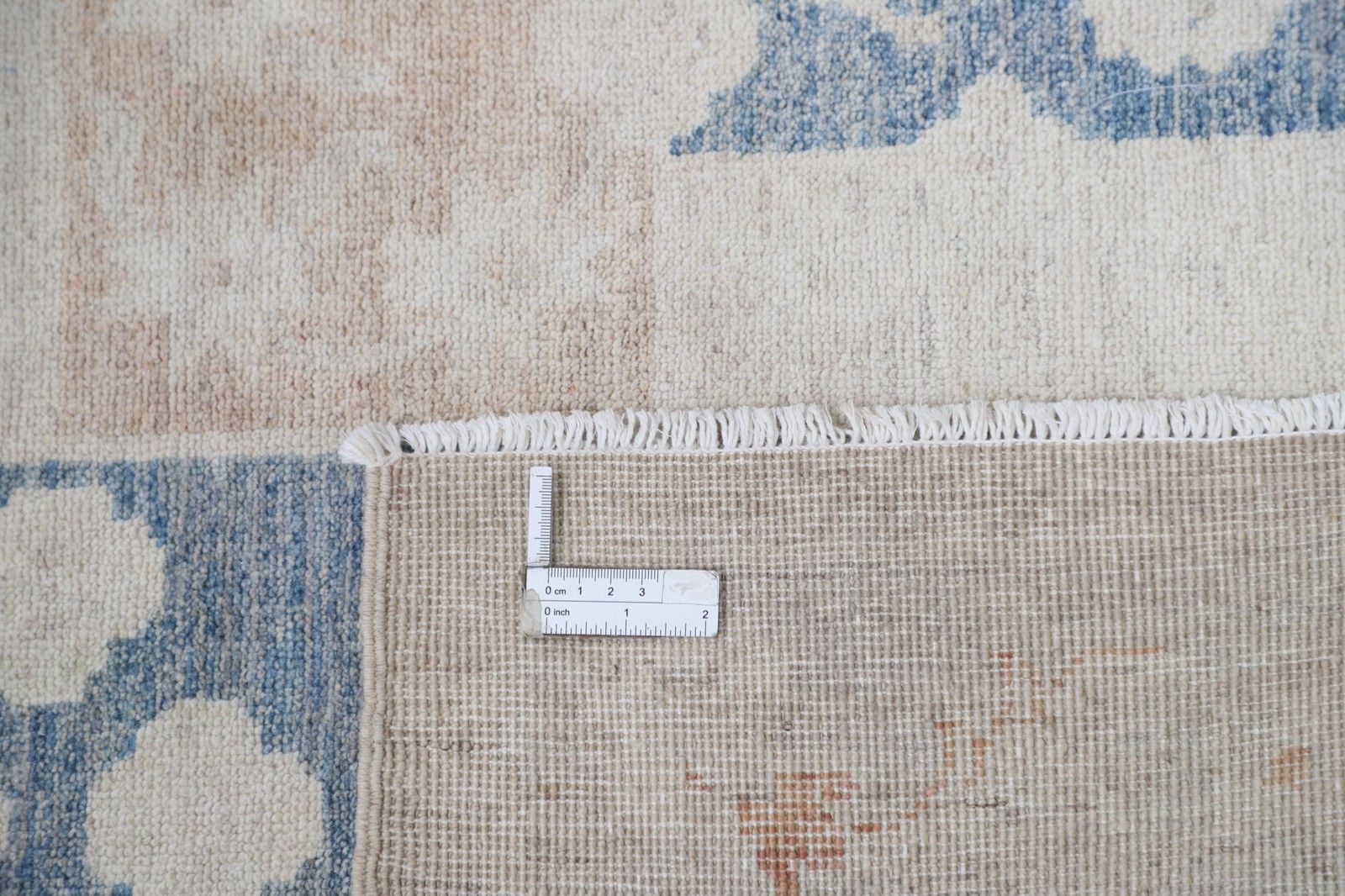 Tapis d'appoint en laine noué à la main, ivoire, bleu et rose poudré, motif géométrique, 105 x 158 cm photo 889.0