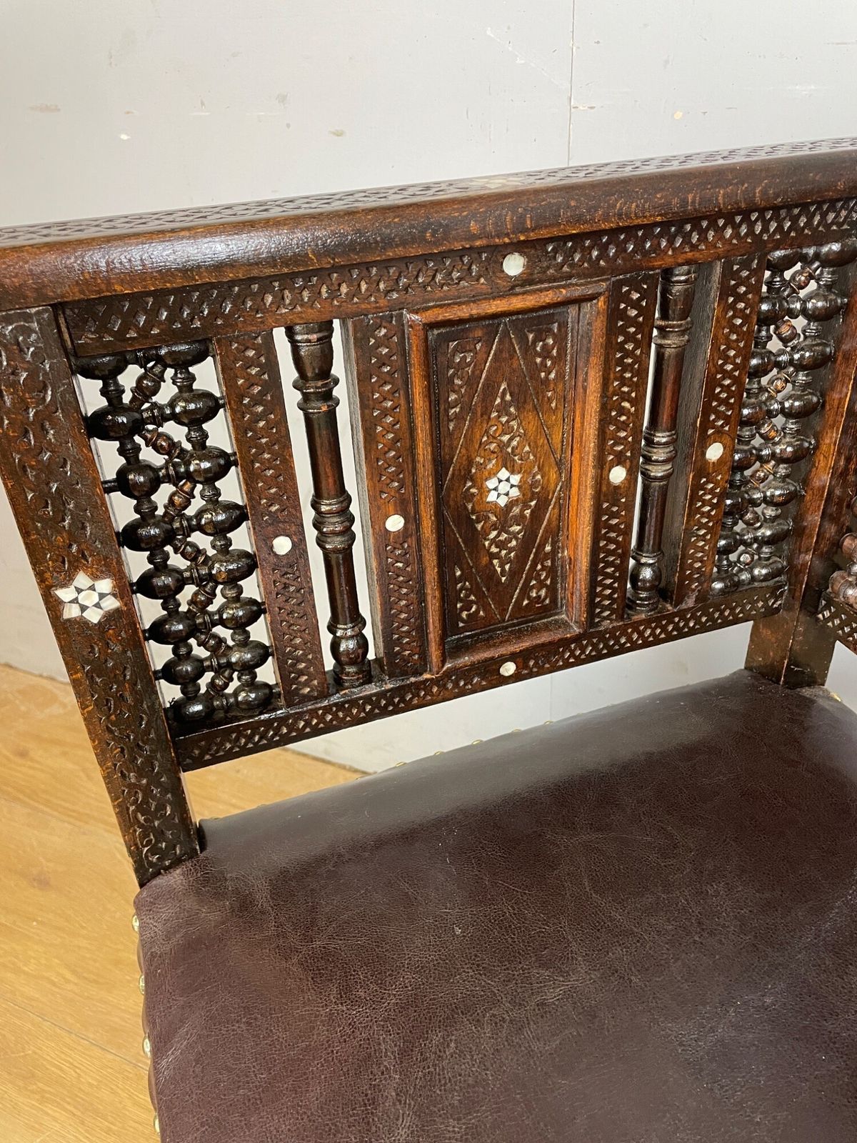 photo furniture C19th Inlaid Carved Corner Chair With Mashrabiya Panels Attributed To Liberty And Co