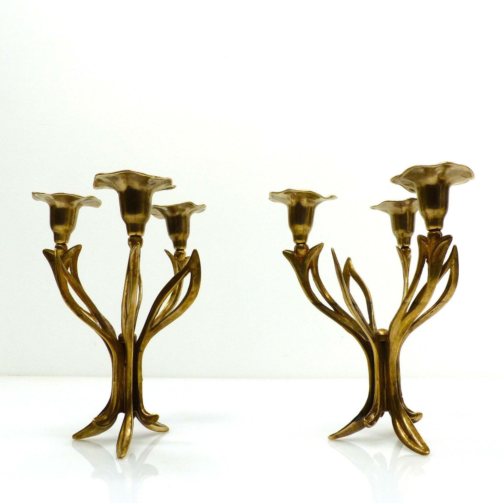 Pair Of Three Light Tripod Brass Candlesticks With Organic Floral Decoration, Circa 1960–1970 photo for sale