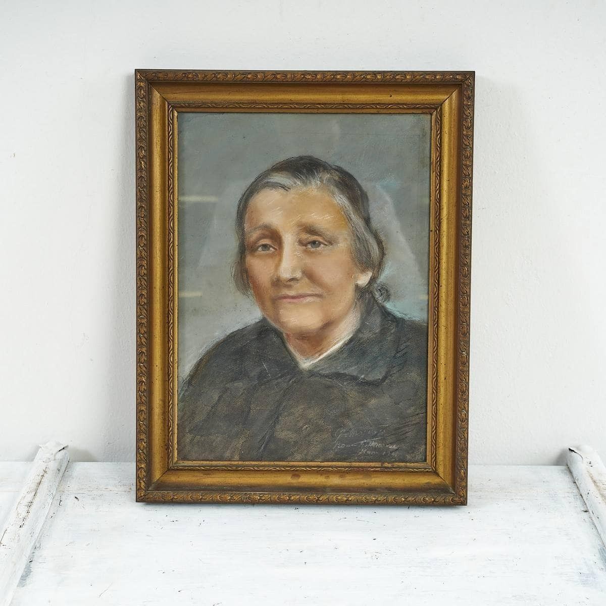 Portrait Of An Elderly Woman In A Golden Frame