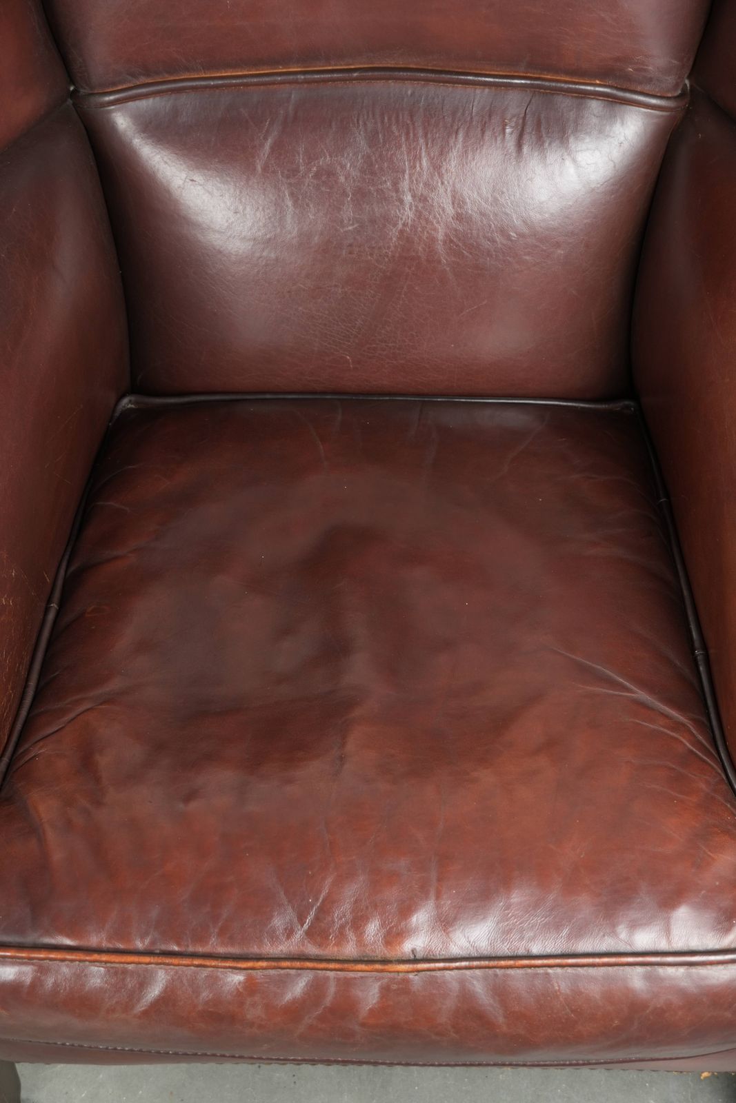 Lovely Vintage Sheepskin Armchair With A High Back In A Beautiful, Subtle Size, Finished With Decorative Nails. photo vinterior