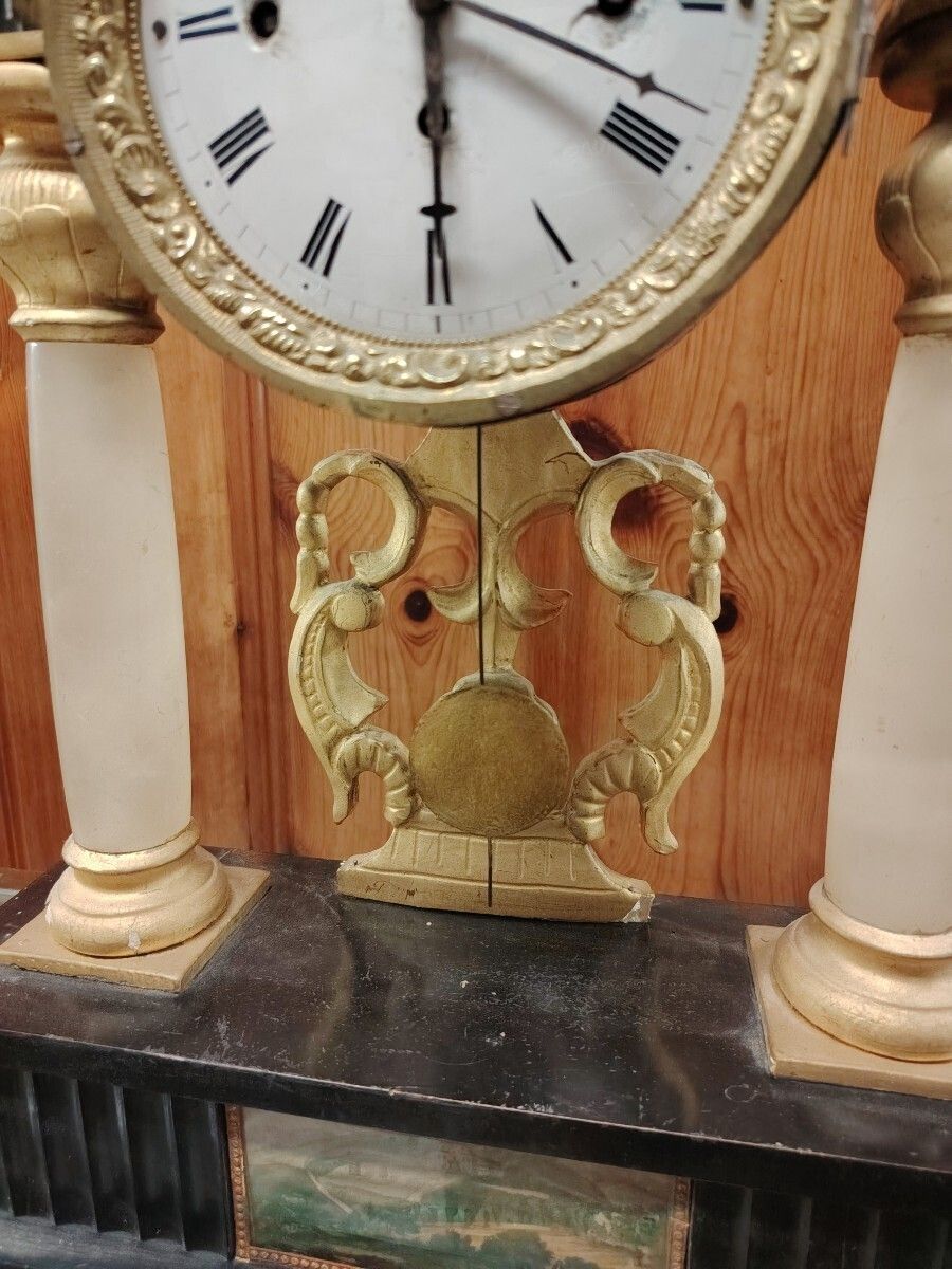 photo for sale Biedermeier Mantel Clock In Ebonized And Gilded Wood, With Alabaster Columns, 19th Century