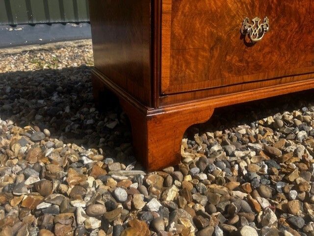 A George II Style Burr Walnut Chest Of Drawers. photo buy