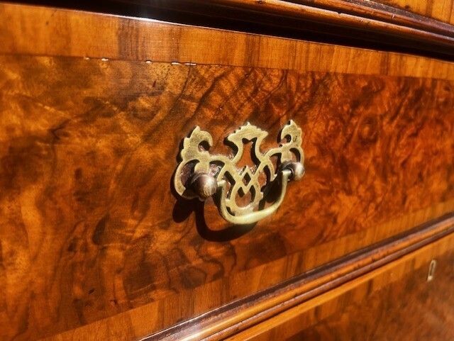 photo furniture A George II Style Burr Walnut Chest Of Drawers.