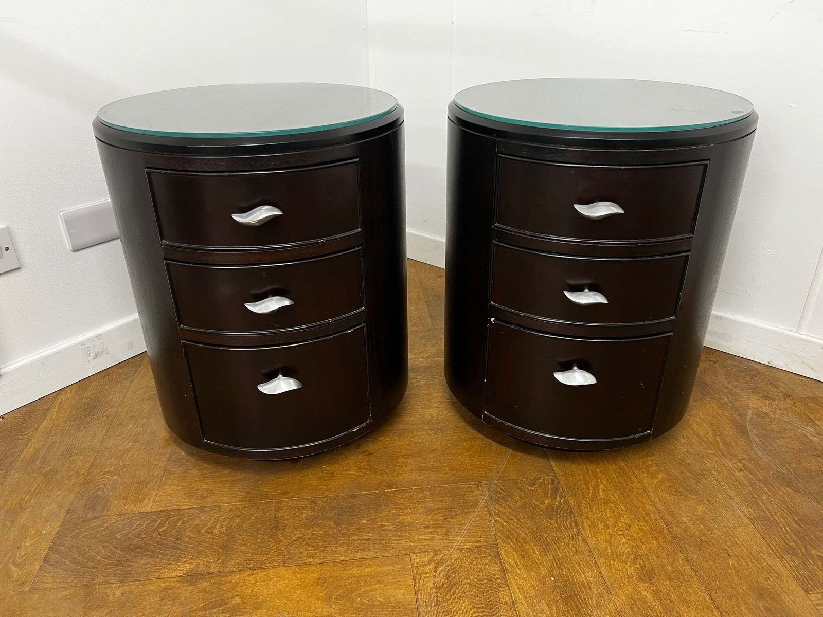 A Pair Of Italian Cylindrical 3 Drawer Beside Drawers In Stained Dark Mahogany With Glass Top