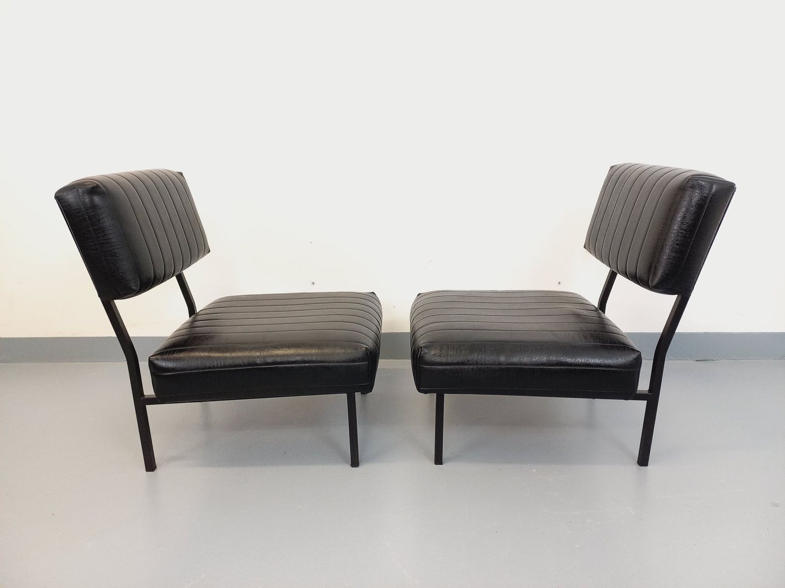 2 Modernist Armchairs In Black Imitation Leather And Metal photo for sale