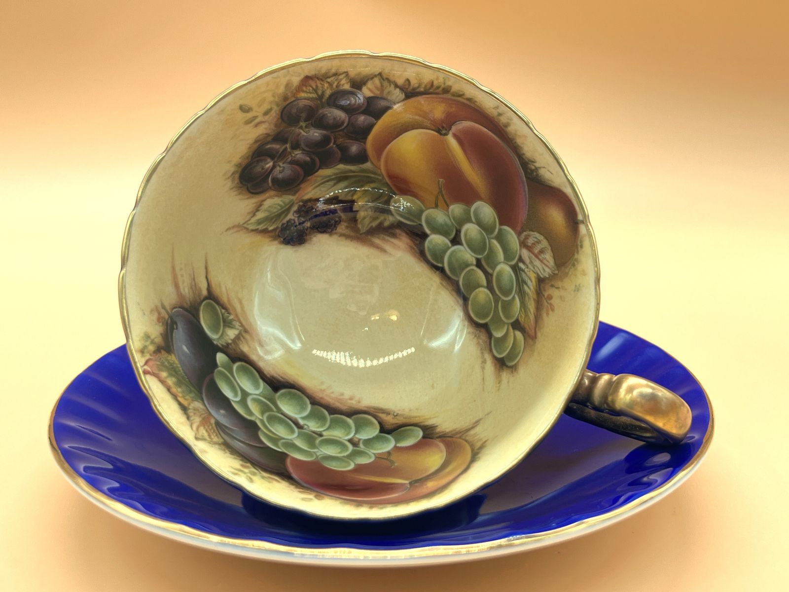 Aynsley China Orchard Gold Fruit Oban Shape Cobalt Blue And Gold Cabinet Tea Cup & Saucer Duo.