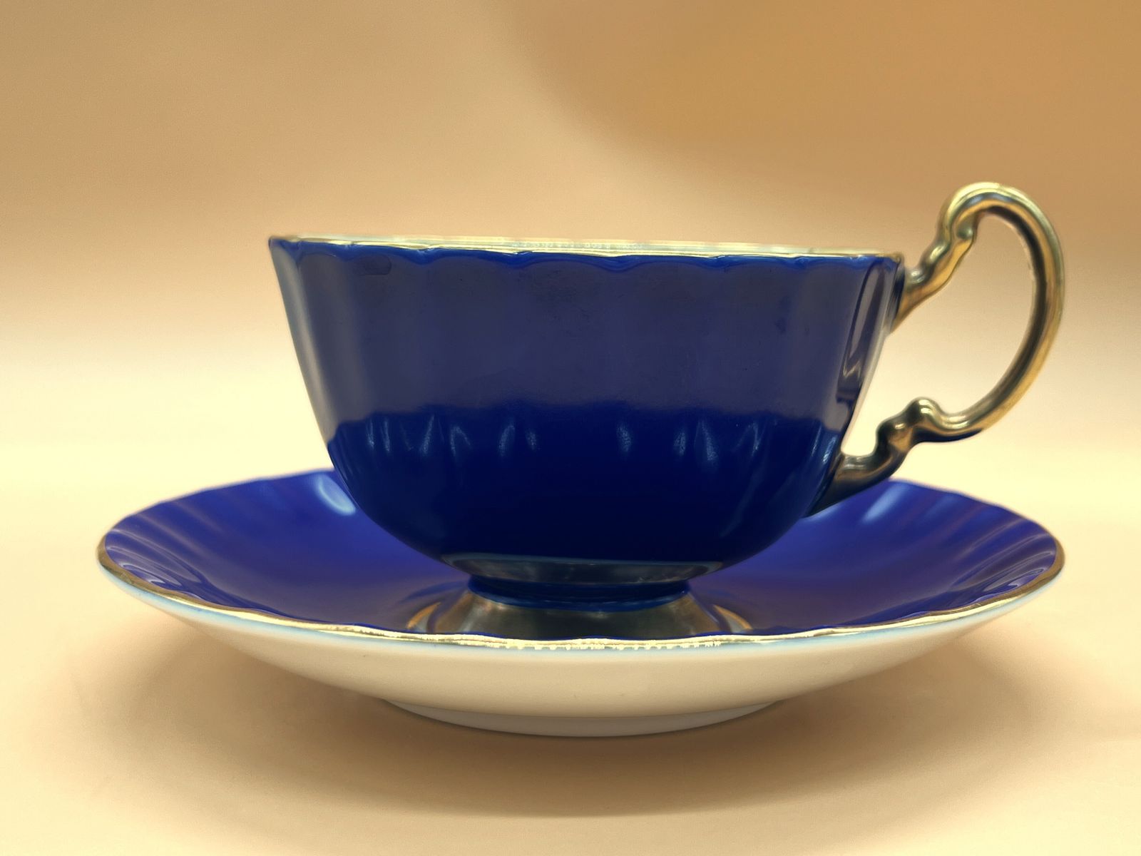 photo furniture Aynsley China Orchard Gold Fruit Oban Shape Cobalt Blue And Gold Cabinet Tea Cup & Saucer Duo.
