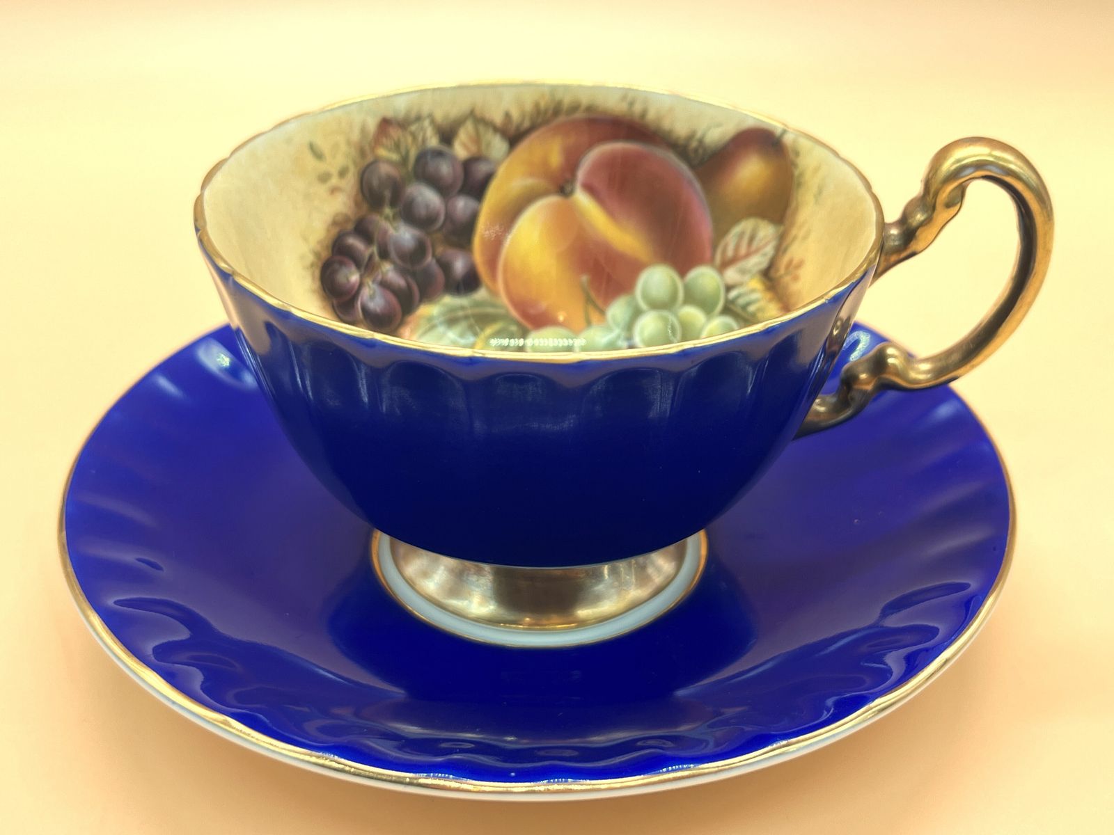 photo for sale Aynsley China Orchard Gold Fruit Oban Shape Cobalt Blue And Gold Cabinet Tea Cup & Saucer Duo.