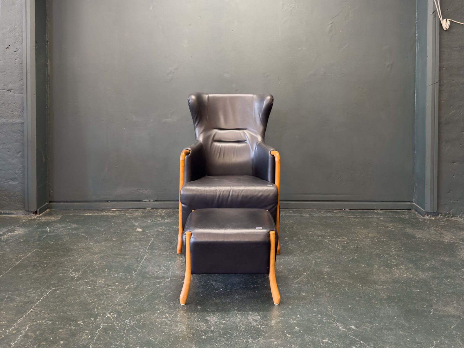 'Claudia' Black Leather And Beech Highback Armchair With Footstool By Stouby photo furniture