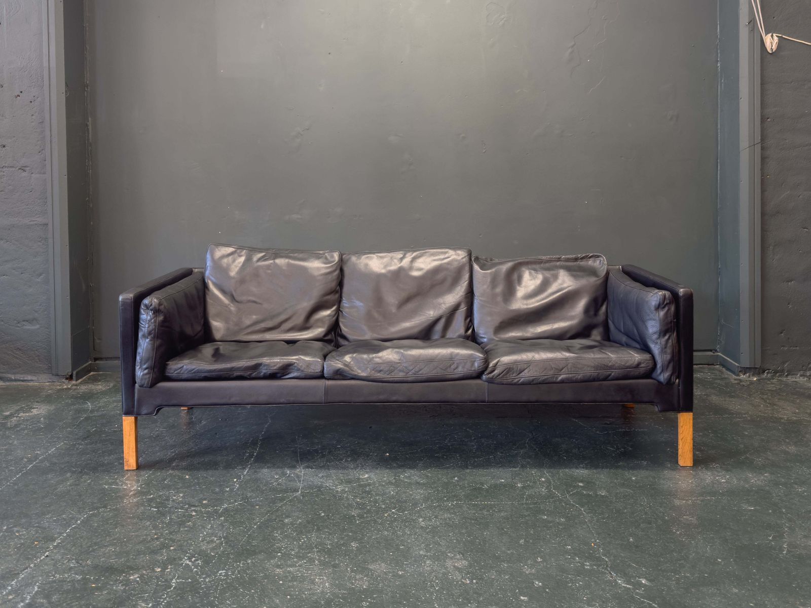 Black Leather Three Seater Sofa