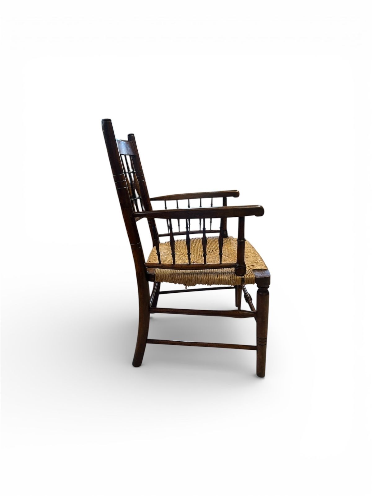 An Aesthetic Movement Rush Seat Armchair Circa 1890, Attributed To Liberty And Co In The Manner Of M photo for sale
