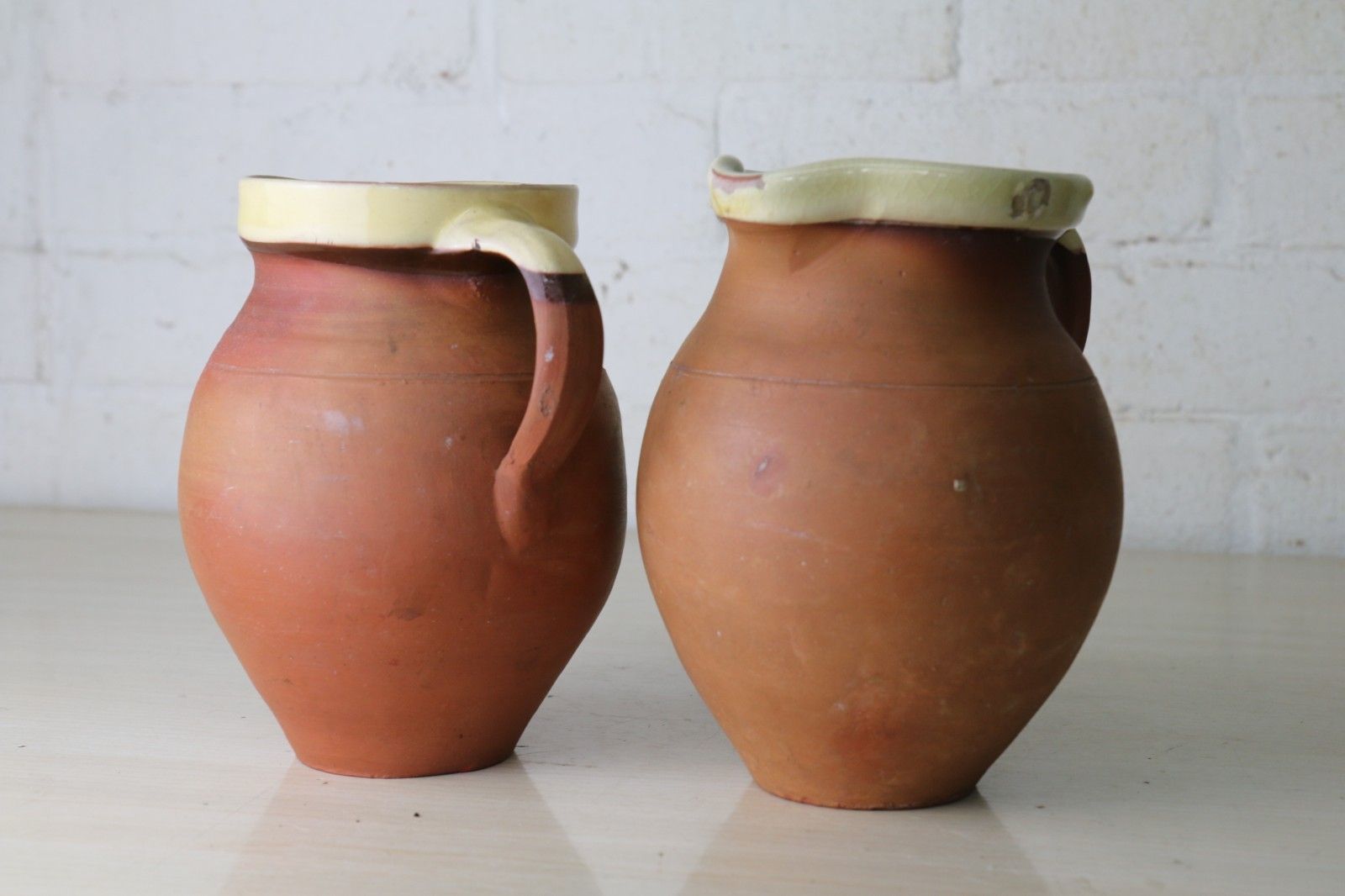 photo buy Two Antique 19th Century Jugs Terracotta Slip Glazed Internally With A Cream Rim