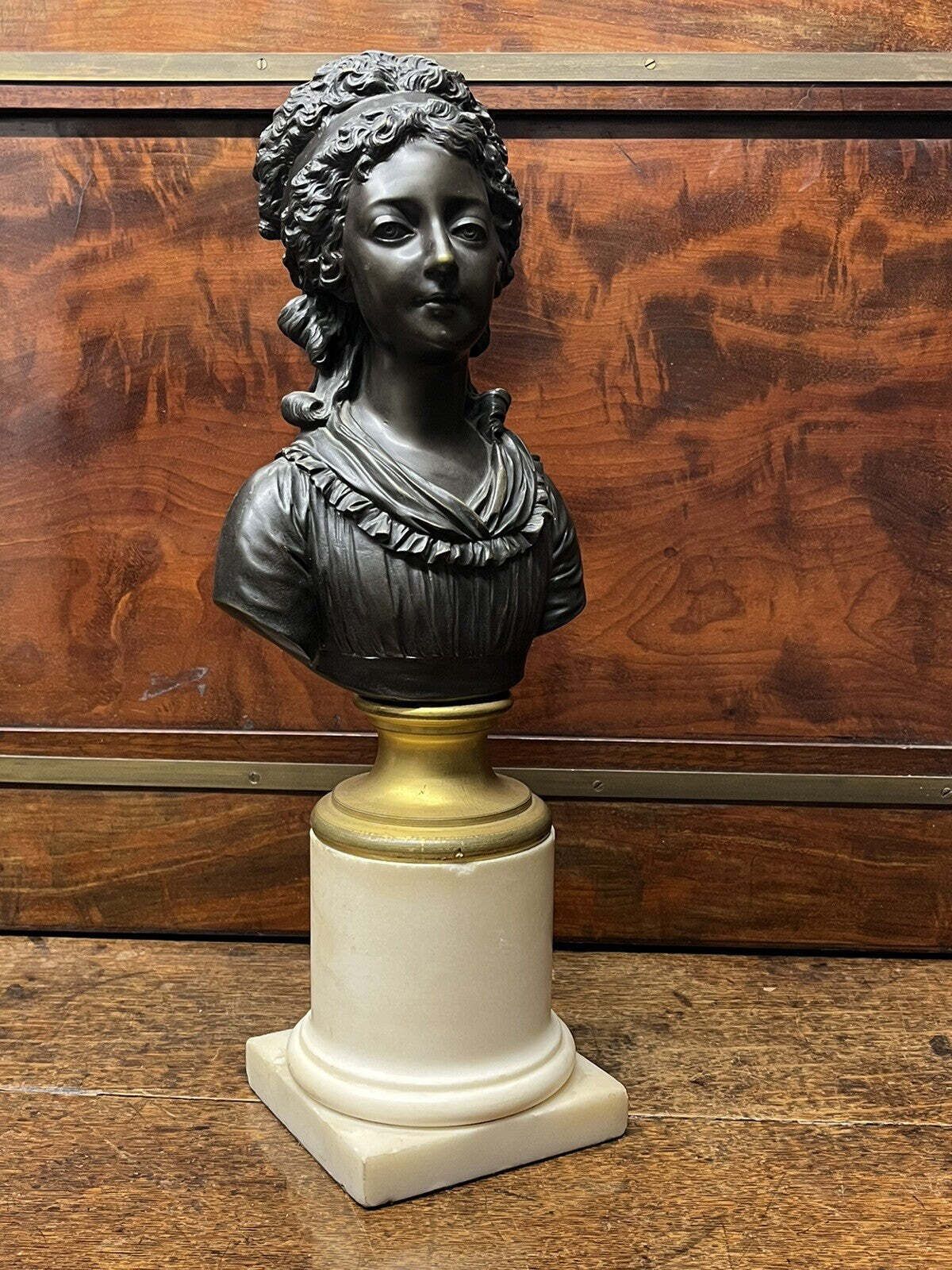 Bronze Bust Of A French Woman On A White Marble Column photo furniture