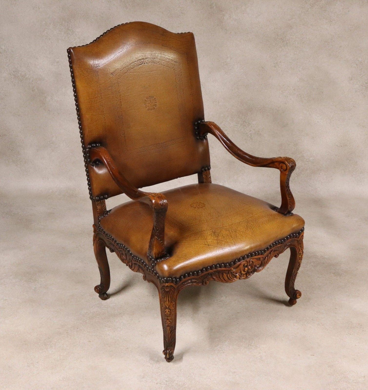 photo furniture Vintage French Louis XV Style Carved Beechwood Fauteuil Tooled Leather Armchair