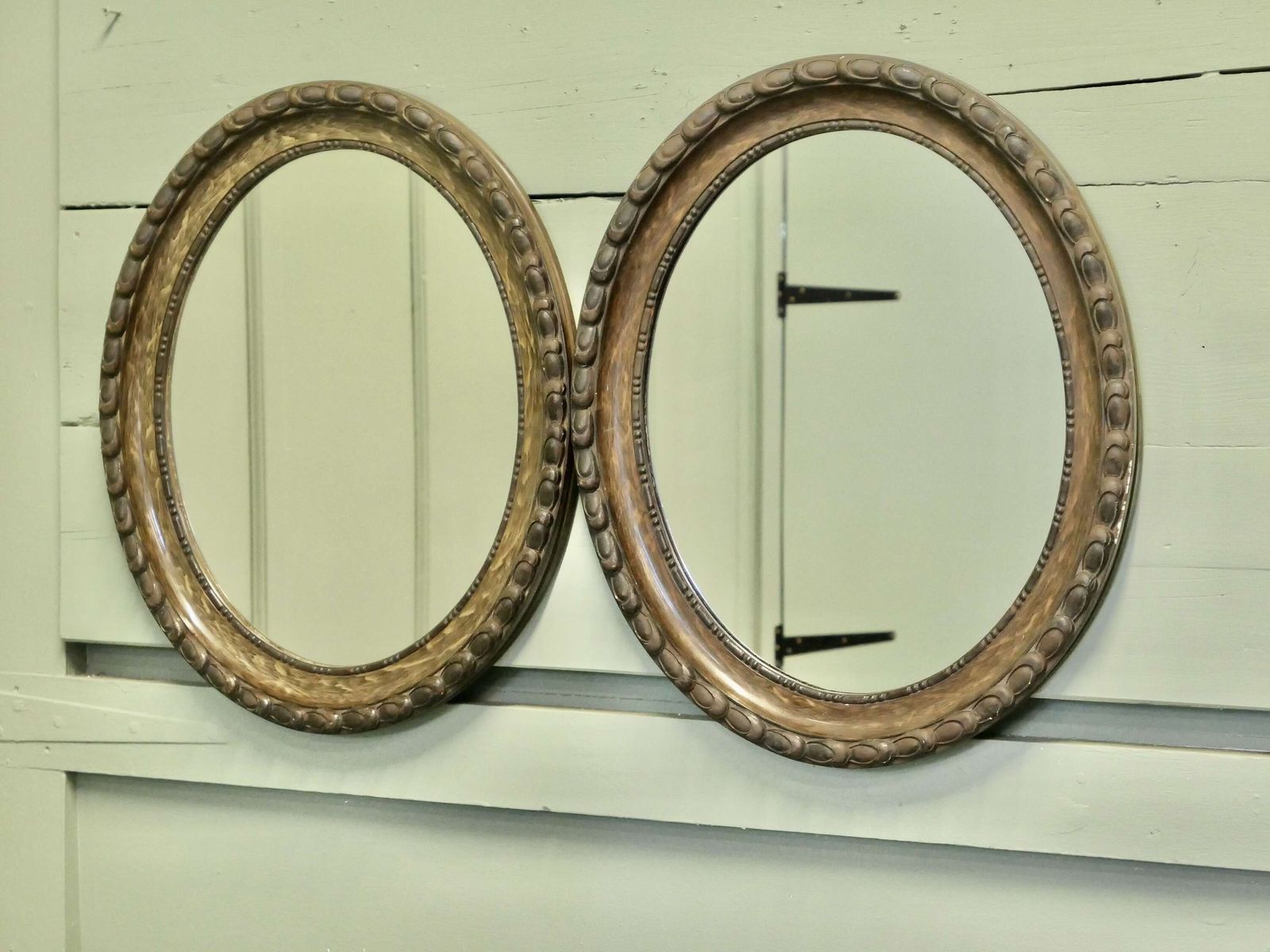 A Pair Of Simulated Wood Finish Oval Mirrors These Mirrors Have Very Attractive Wide Moul