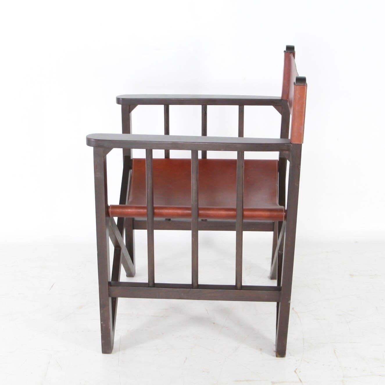 photo furniture Pair Of Leather And Wood Armchairs