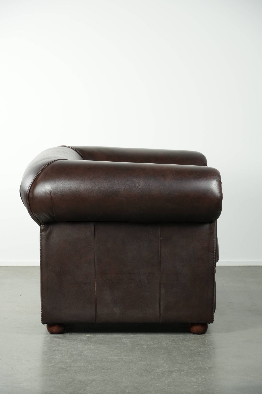 Luxurious Brown Cowhide Chesterfield Armchair With A Timeless English Look. photo for sale