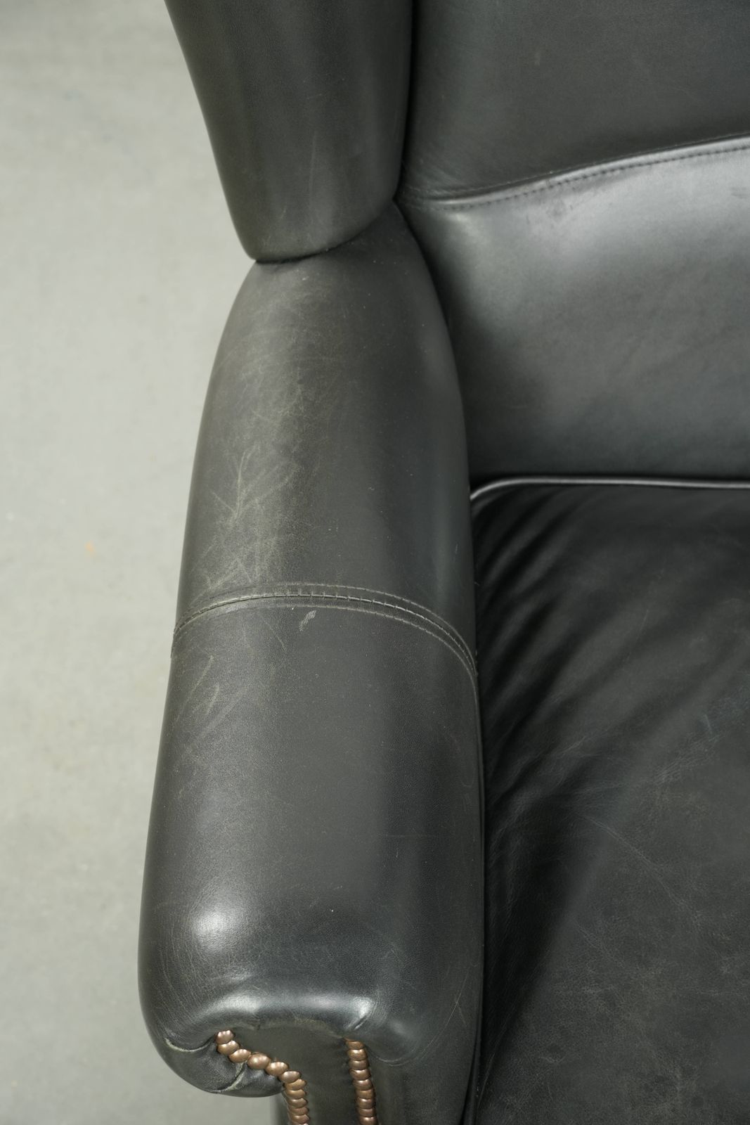 Black Cowhide Wing Armchair In A Classic English Style, Finished With Decorative Nails. photo buy