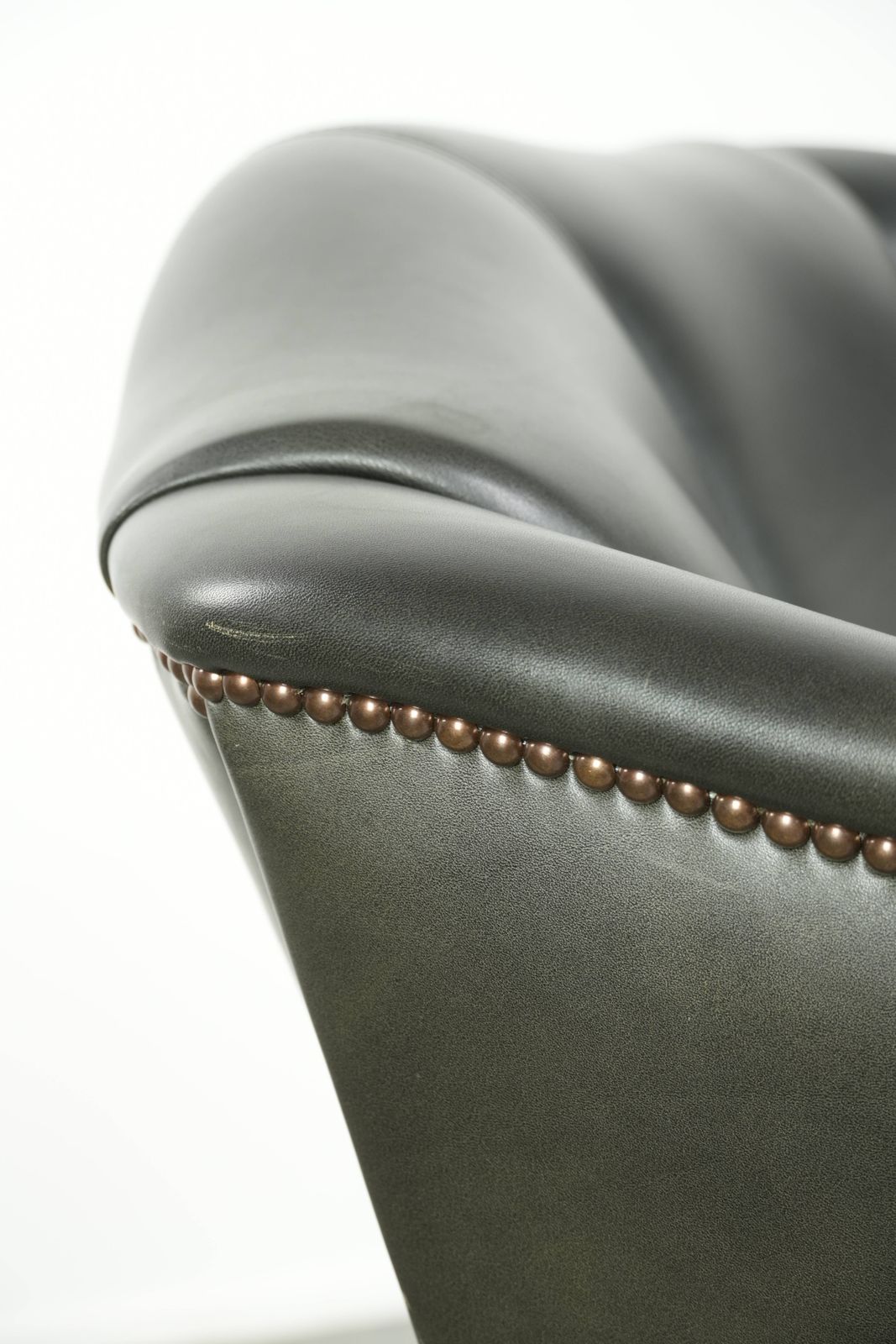 photo vinterior Black Cowhide Wing Armchair In A Classic English Style, Finished With Decorative Nails.
