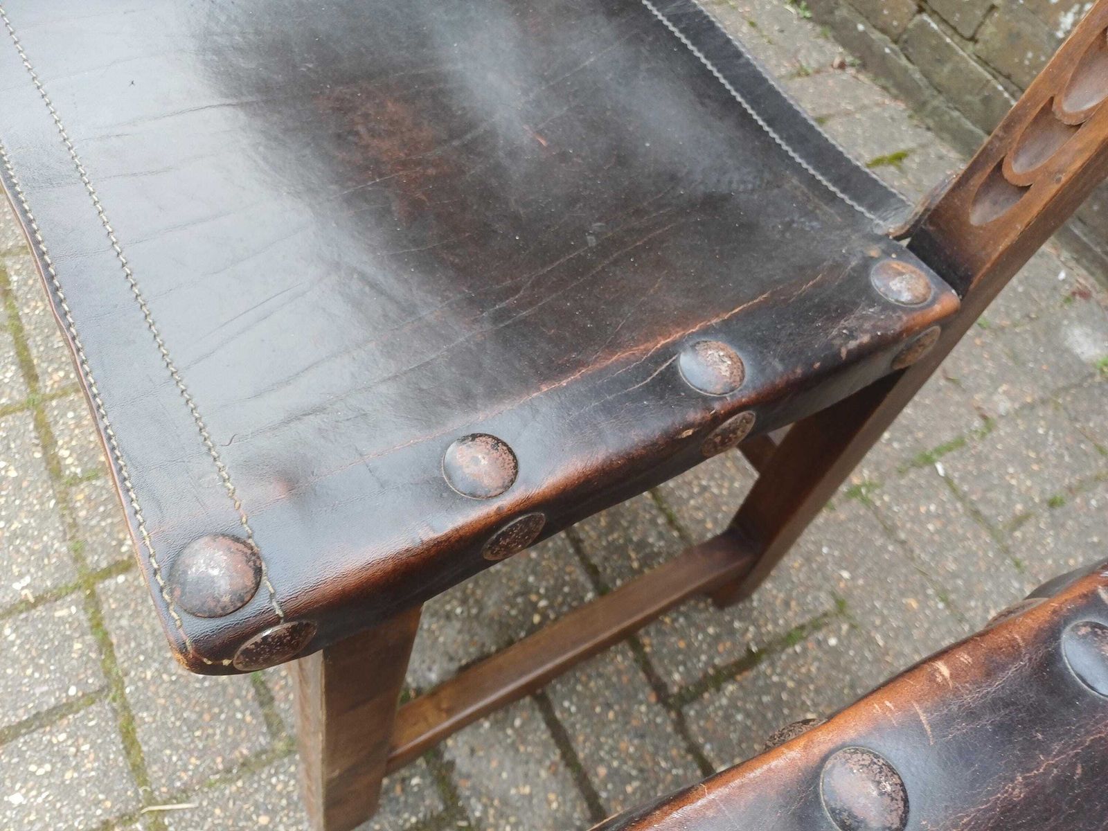 Set Of 4 Vintage Spanish Style Oak And Leather Dining Chairs Carved Wood Studded Seats Rustic 1980s Kitchen Dining Chairs photo vinterior
