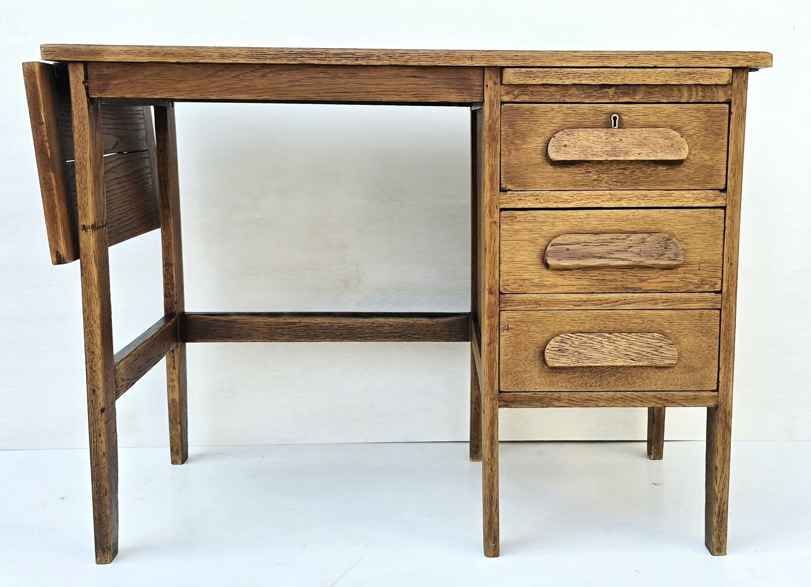 A Petite Mid Century Oak Drop Leaf Desk, Single Pedestal.